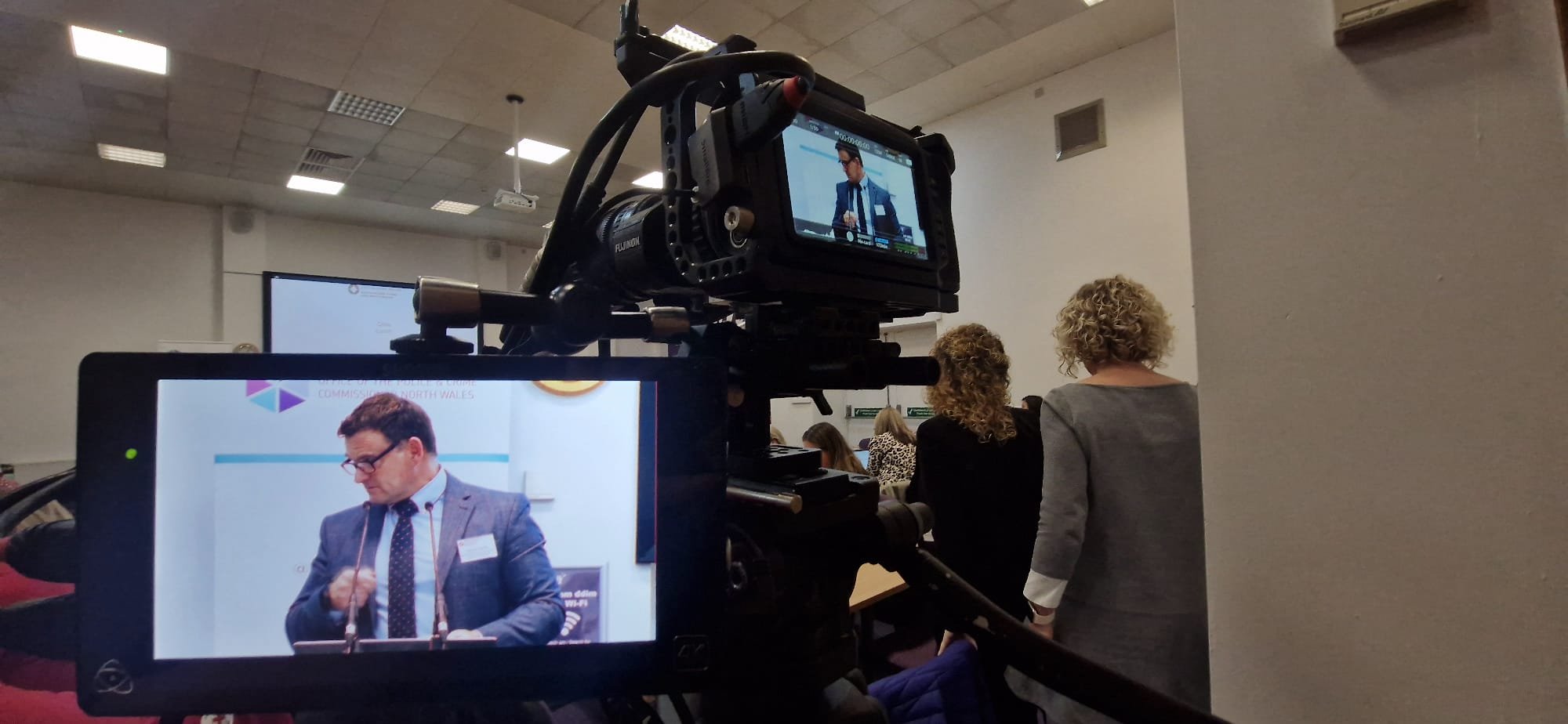 camera view of presenter at corporate conference stream