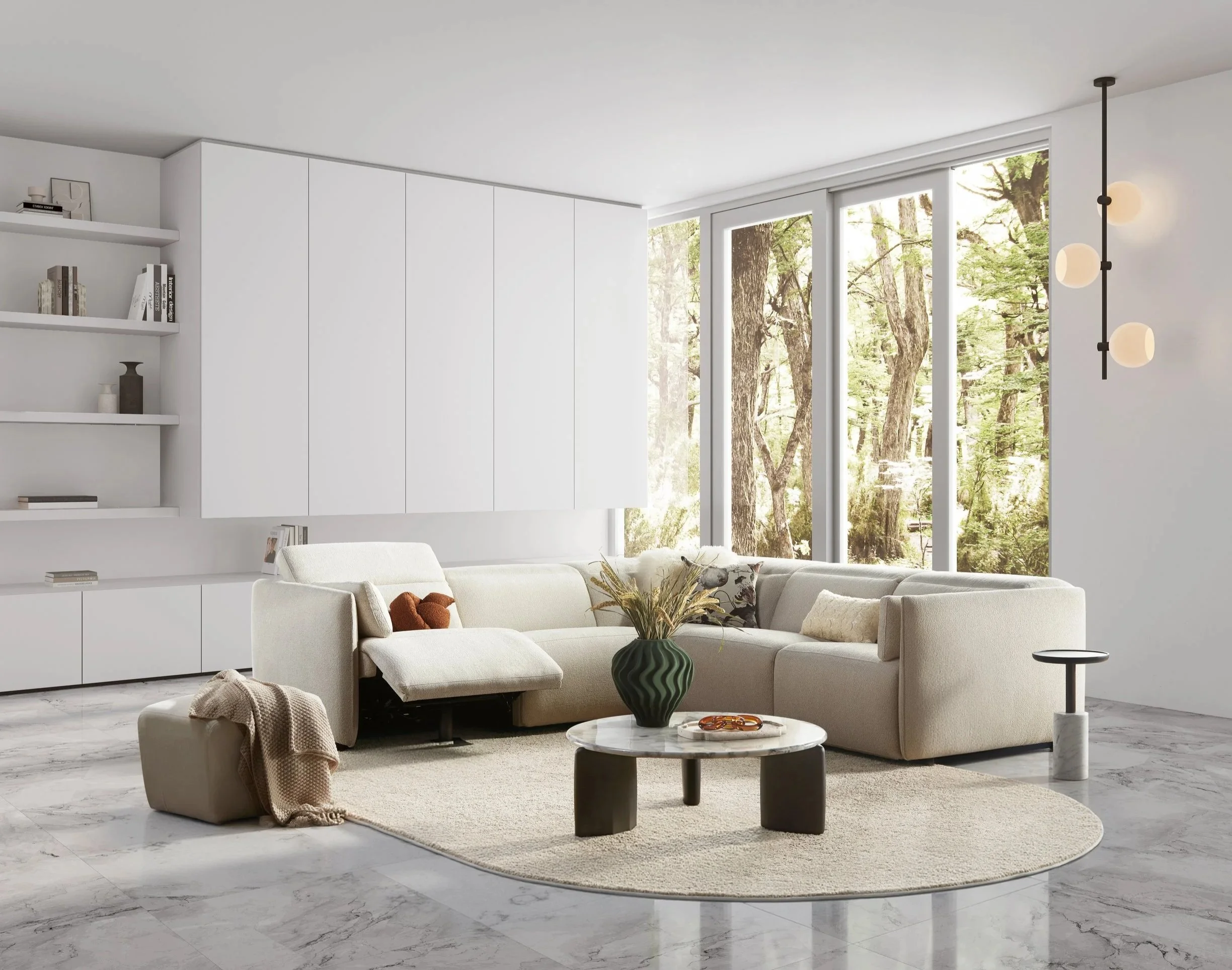 Modern living room with large windows overlooking trees, a white sectional Nest Space sofa with cushions, a round coffee table with decorations, and a marble floor.