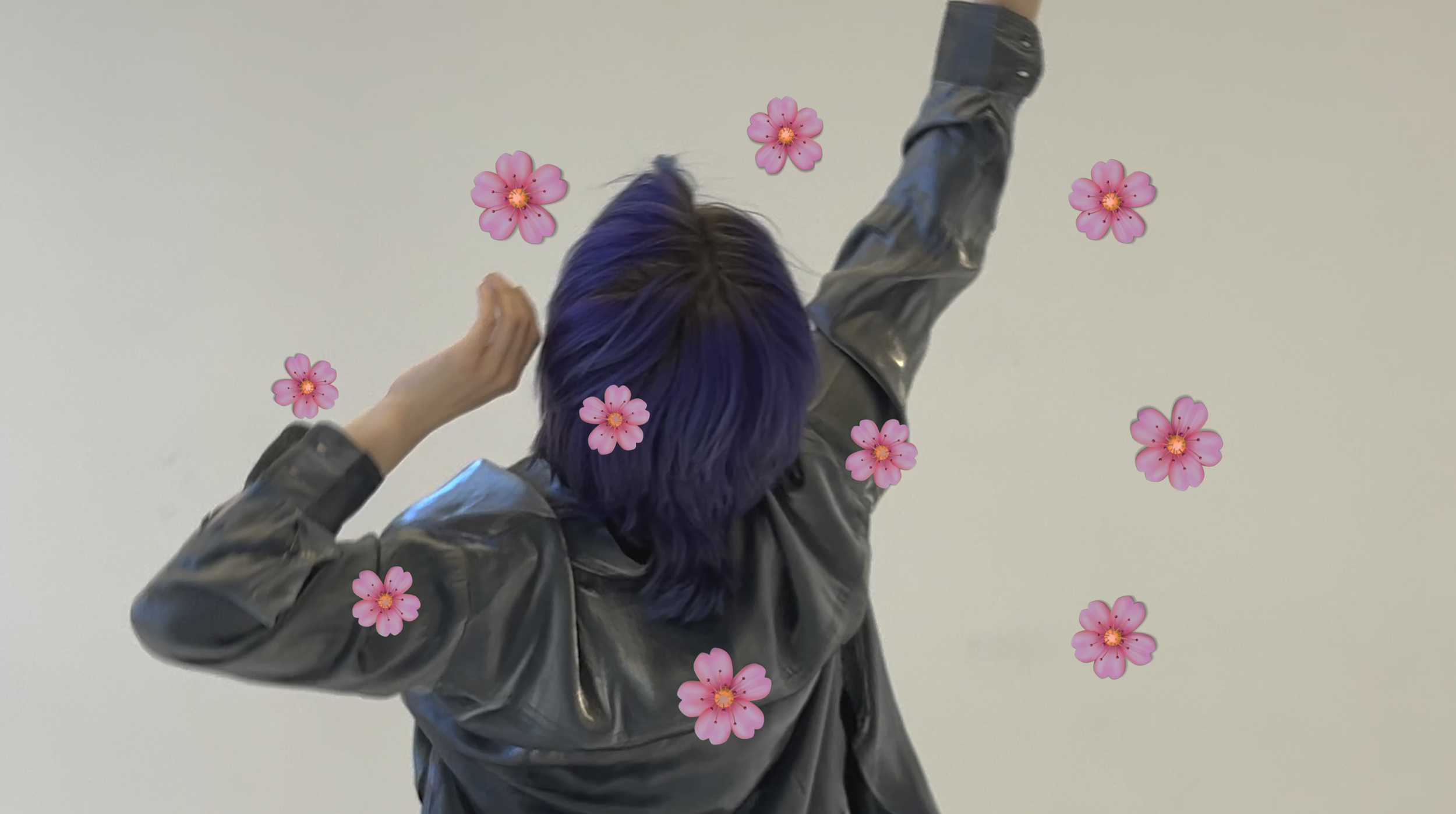 Person with purple hair stretching with arms raised, wearing a shiny jacket, surrounded by pink flower stickers.