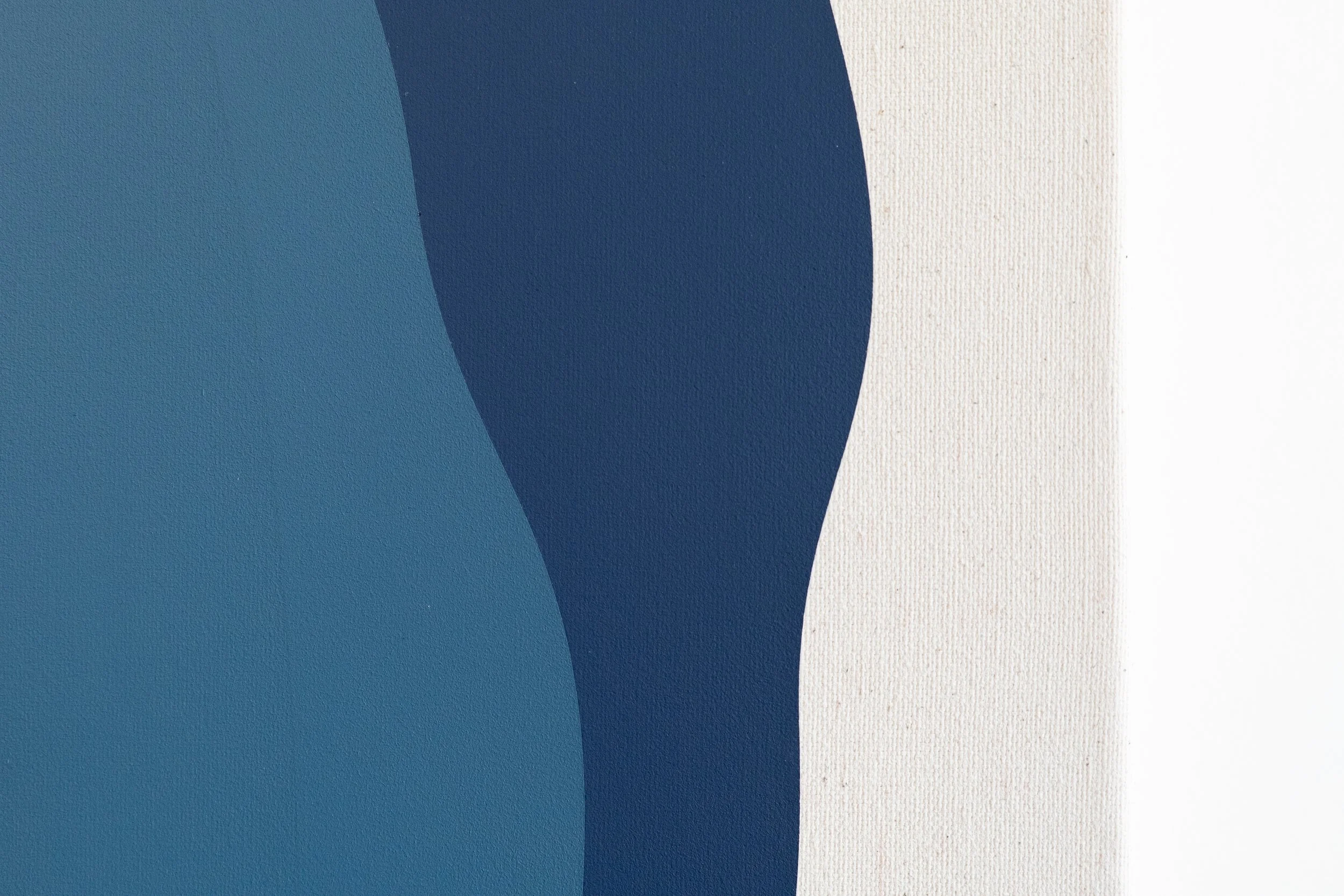 Close-up of abstract art with various shades of blue and white, featuring curved shapes and textured canvas surface.