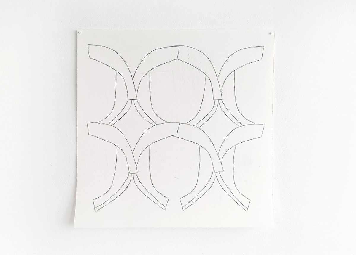 Sketch of a geometric pattern with overlapping circles and arches on a white background.
