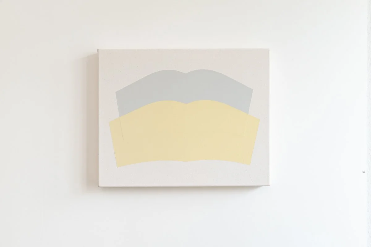 Abstract artwork with three layered shapes in gray, yellow, and light beige on a white canvas