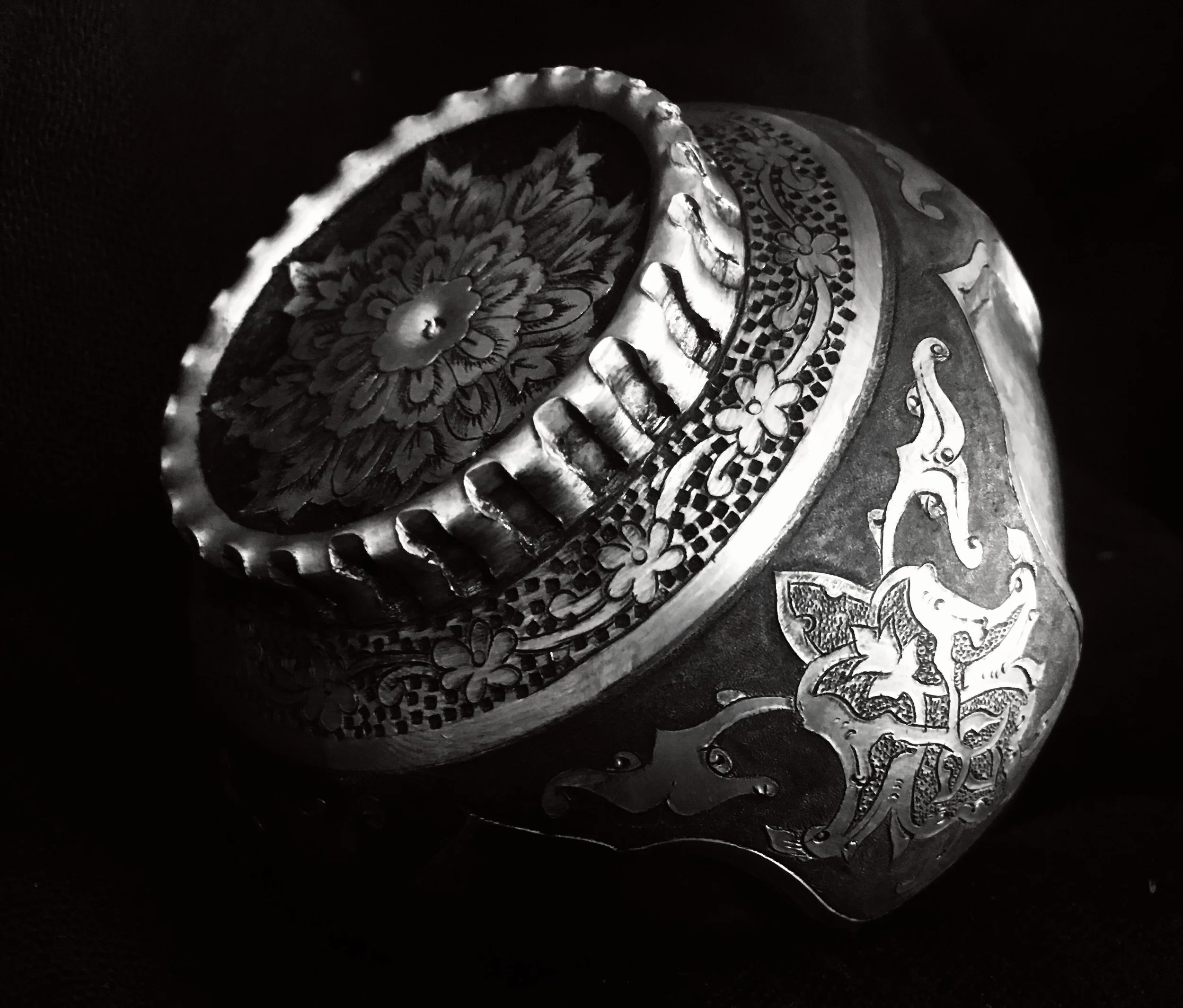 intricate miniature, persian geometries and symbols handcrafted on a sphere