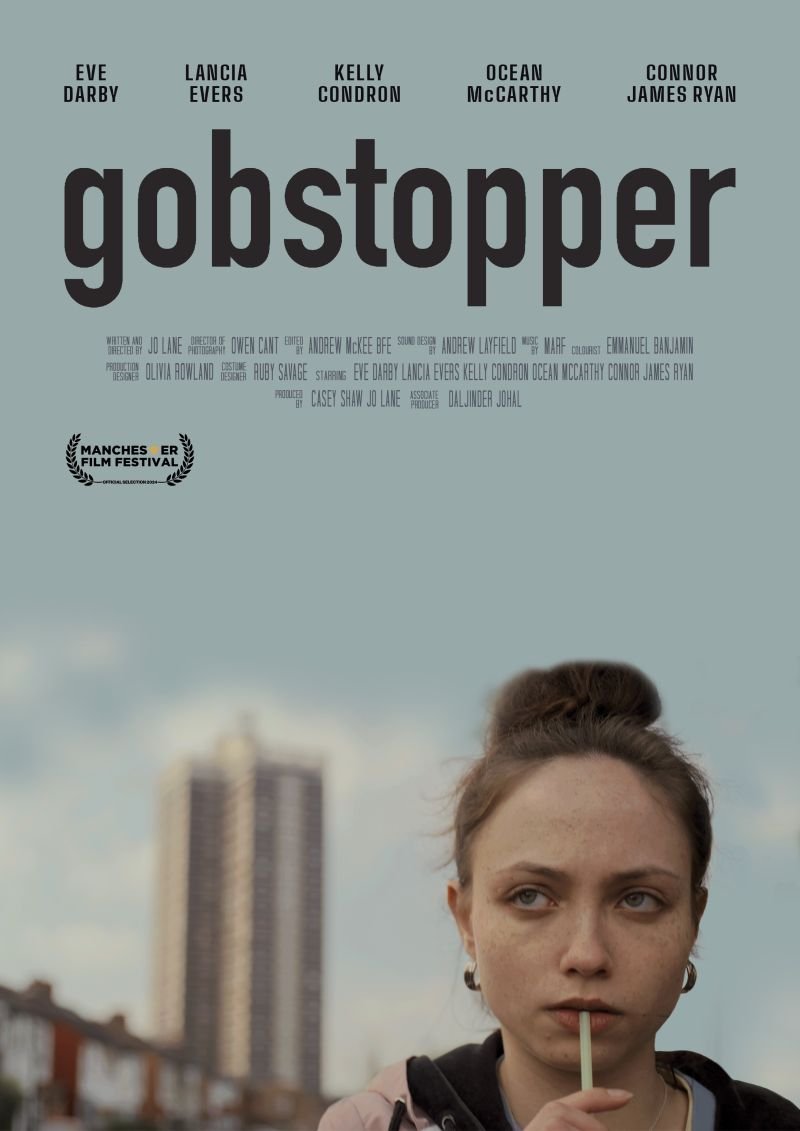 Movie poster for 'GOBSTOPPER' featuring a young woman with a straw in her mouth, blurry cityscape background, and cast and crew credits at the top.