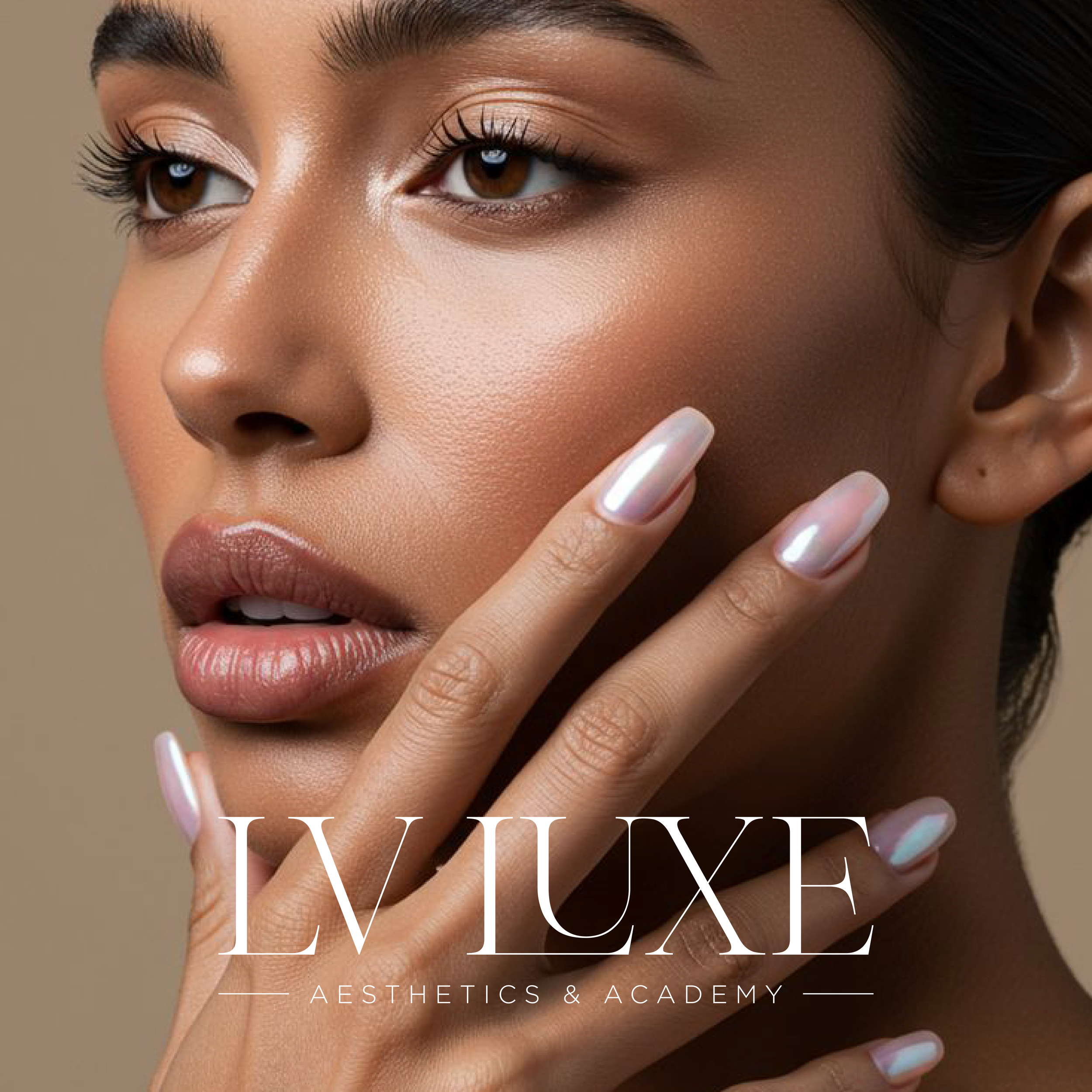 Close-up of a woman's face with flawless skin, soft makeup, and manicured nails, touching her face with her fingers, with the text 'LV LUXE AESTHETICS & ACADEMY' overlayed at the bottom.