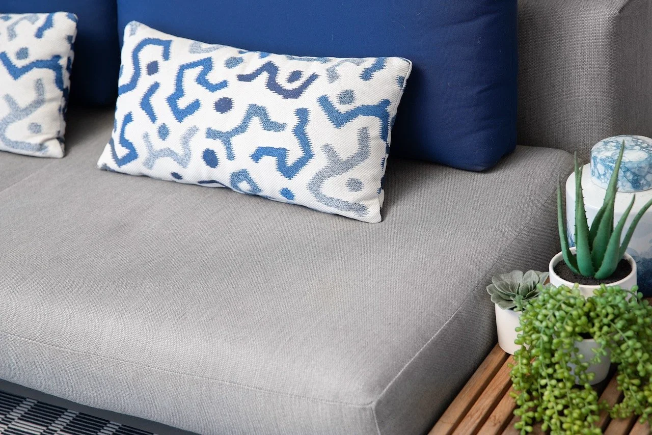 modern-penthouse-balcony-blue-ikat-pillow-detail-succulent-gloria-black-design.jpeg