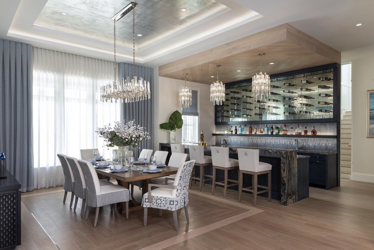 new-england-charmer-dining-crystal-chandelier-gray-chairs-wood-table-gloria-black-design-©03.jpeg