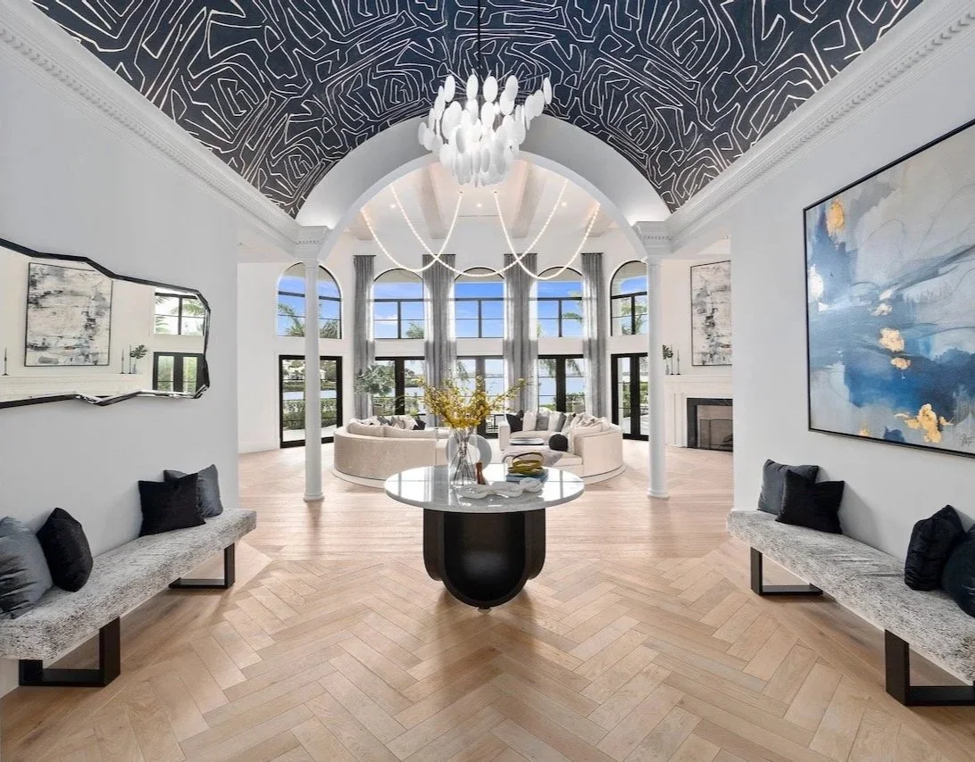 writers-repose-award-winning-great-room-barrel-vault-mural-chandelier-herringbone-floor-gloria-black-design-naples.jpg