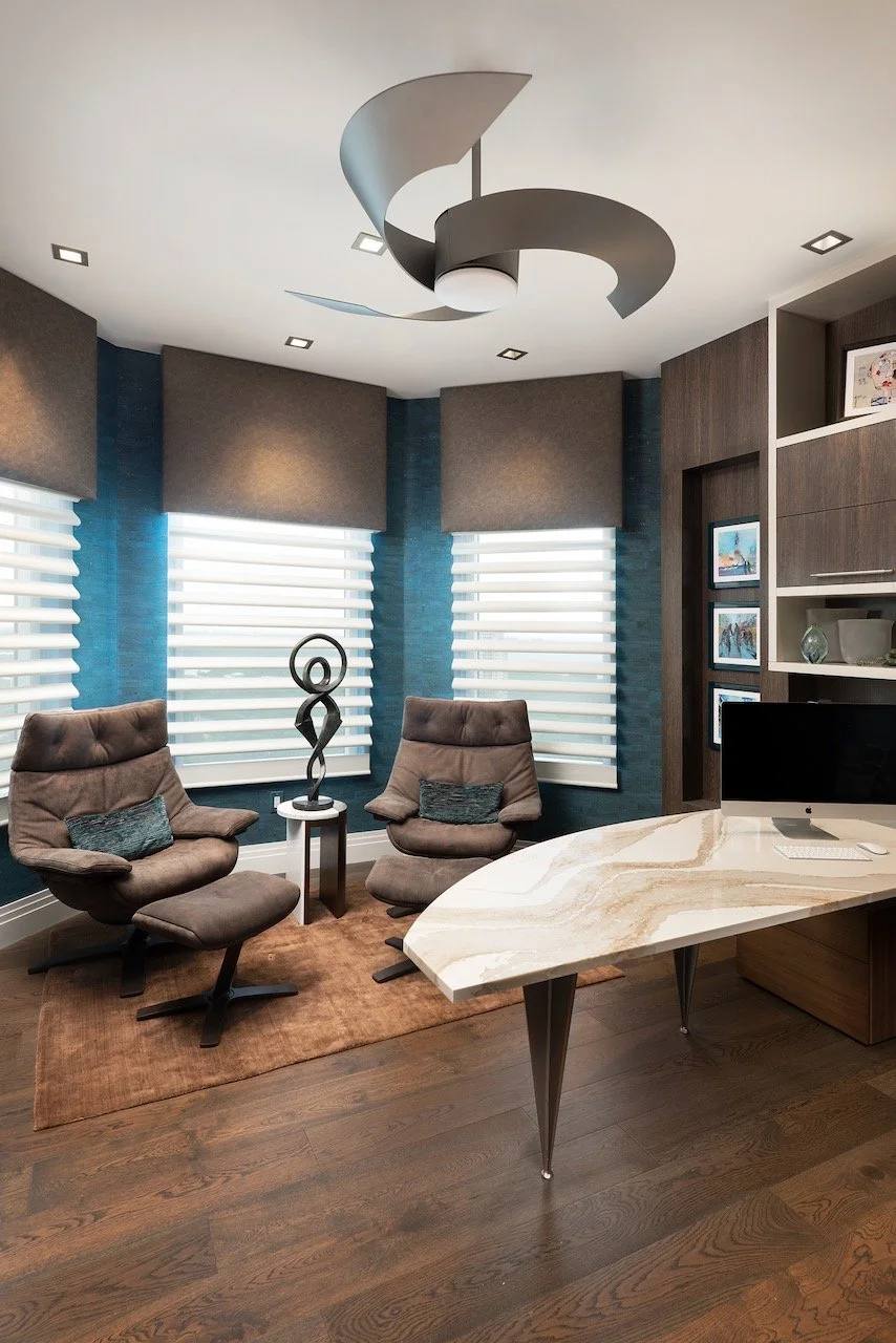 modern-penthouse-office-lounge-chairs-teal-roller-shades-sculpture-bonita-springs-gloria-black-design.jpeg