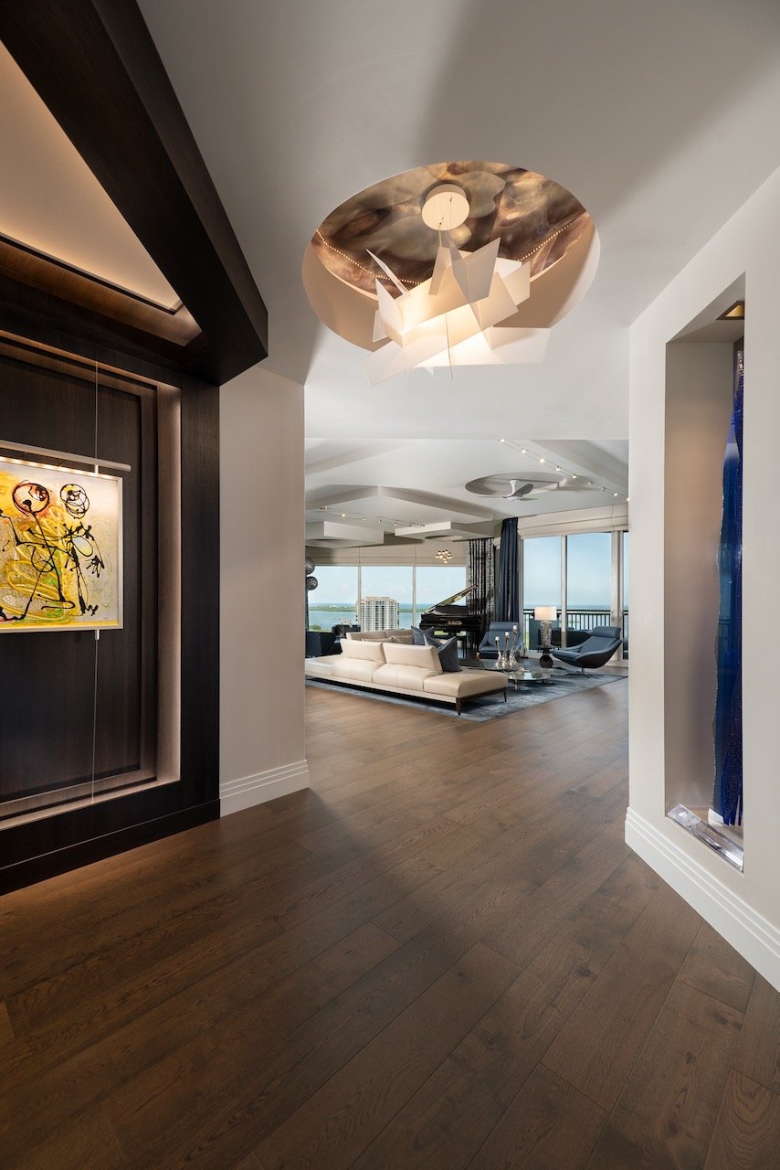 modern-penthouse-living-room-sectional-clemente-art-moody-lighting-gloria-black-design.jpeg