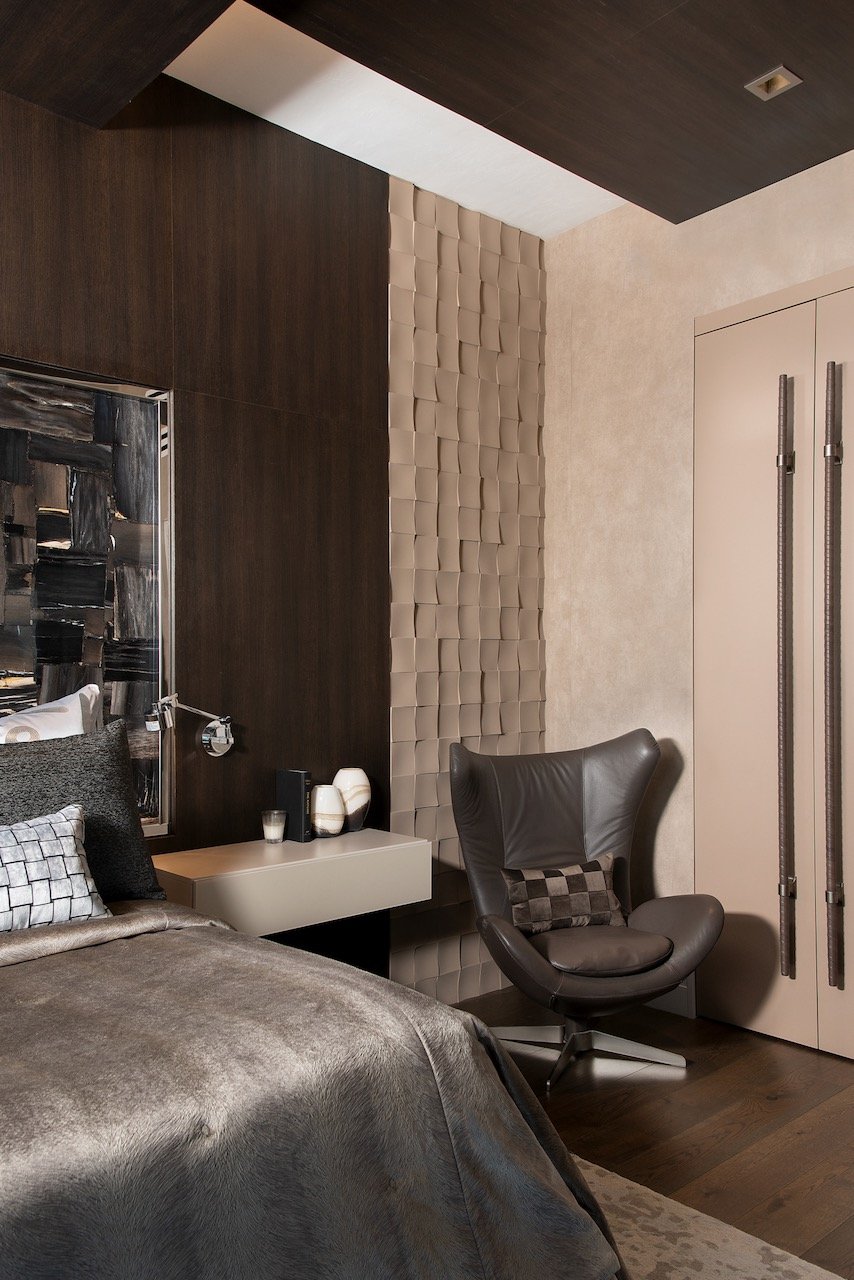 modern-penthouse-primary-bedroom-sitting-area-lounge-chair-custom-doors-leather-handles-gloria-black-design.jpeg