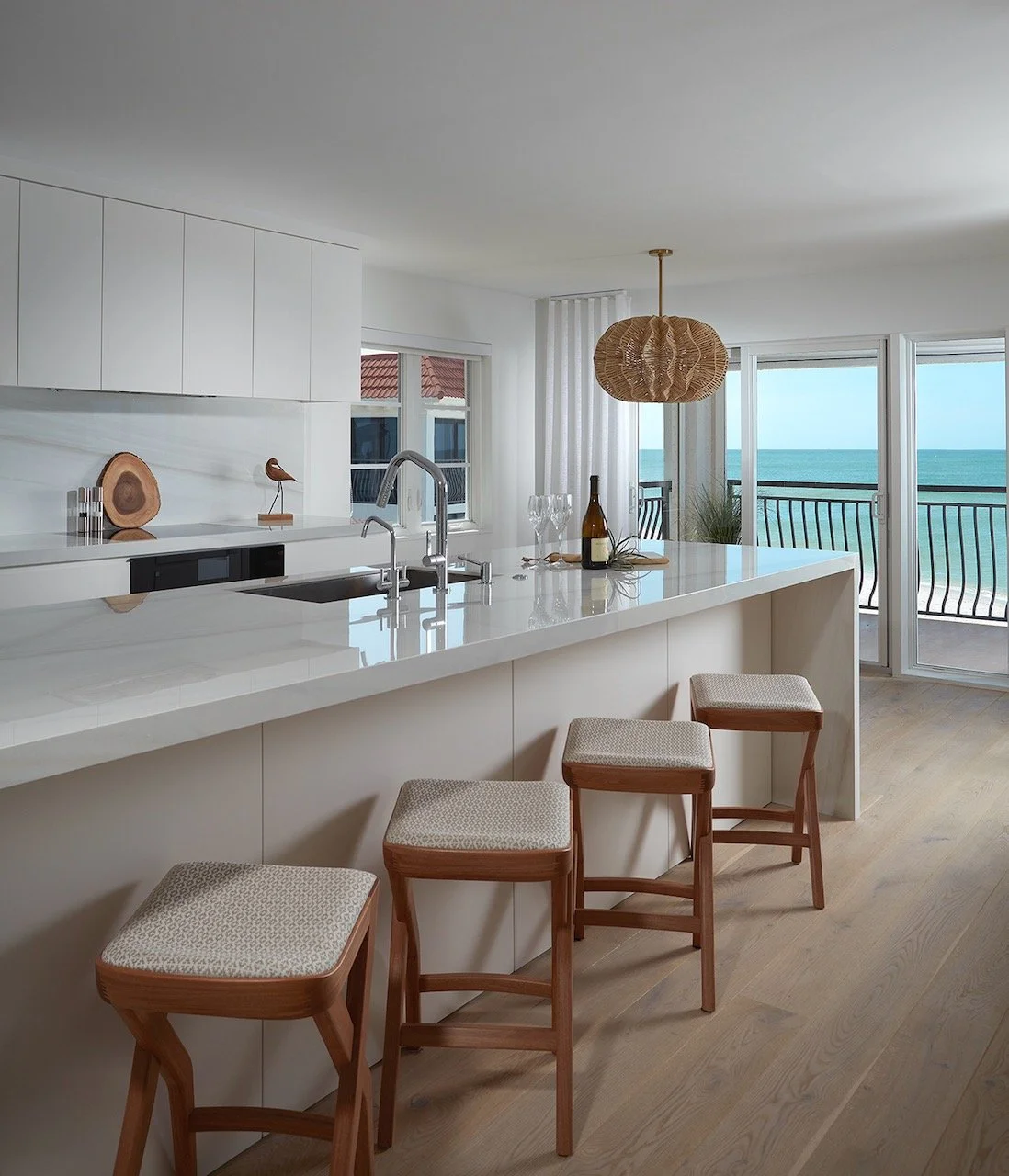 gulfshore-getaway-kitchen-bar-ergonomic-brazilian-chairs-gulf-views-gloria-black-design.jpeg
