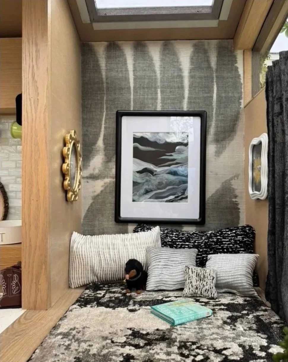 Great WOOF Lodge luxury interior with linen wallcovering, gold baroque mirror, framed artwork and custom pet bedding — Gloria Black Design Naples Florida