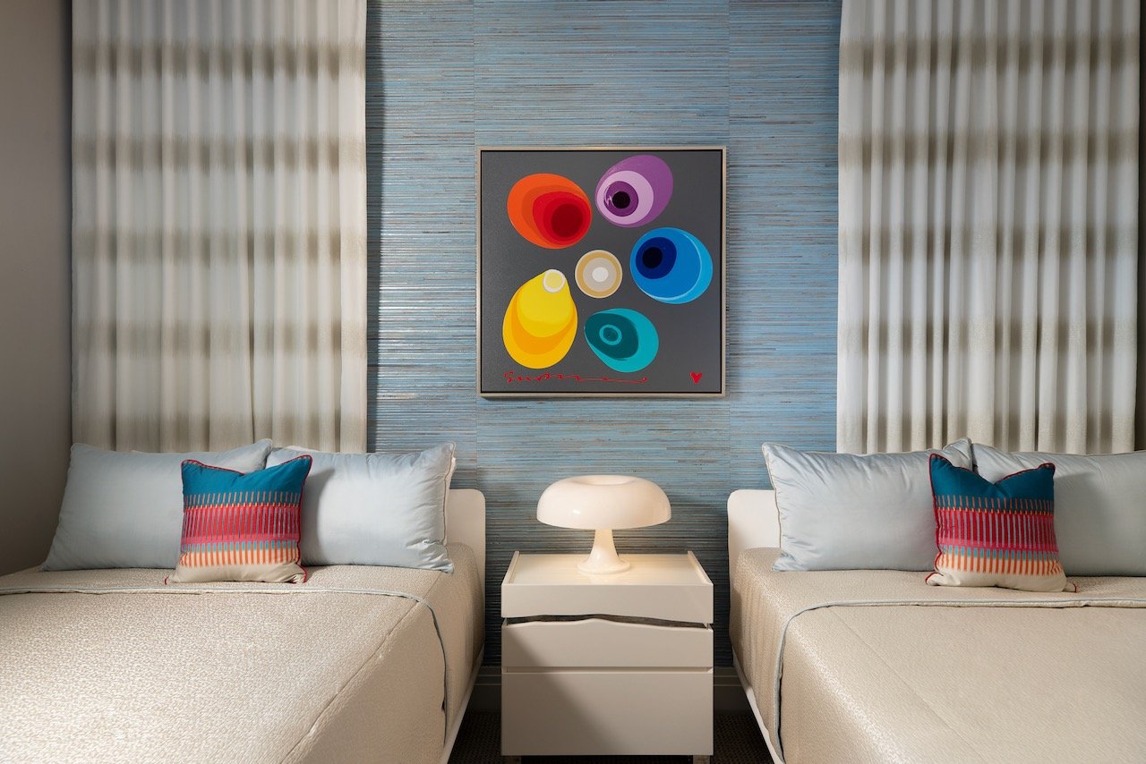 modern-penthouse-guest-bedroom-colorful-abstract-norman-bull-art-blue-accents-gloria-black-design.jpeg