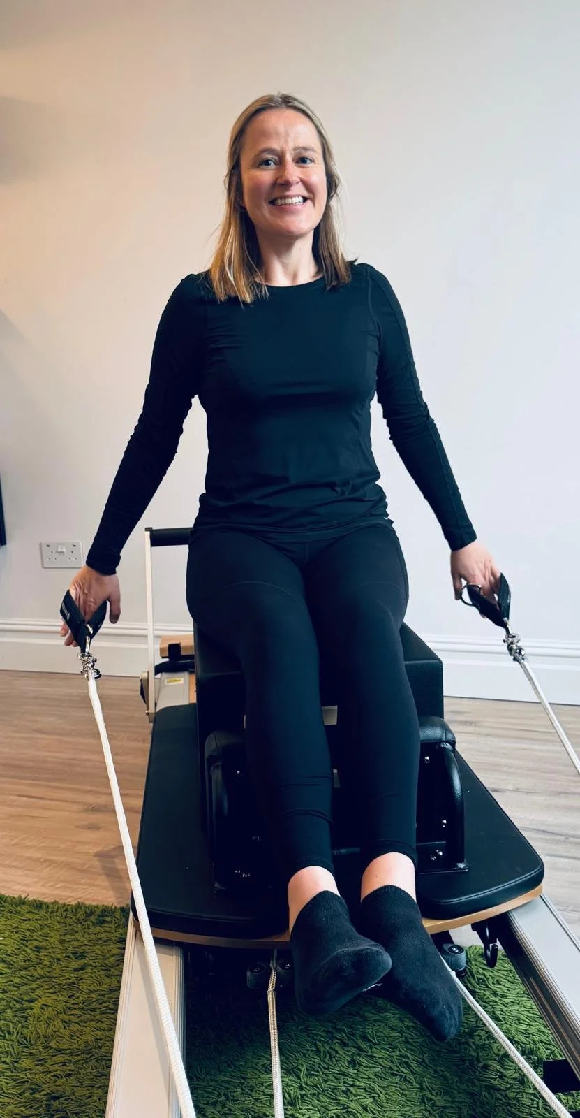 Clare using a reformer machine