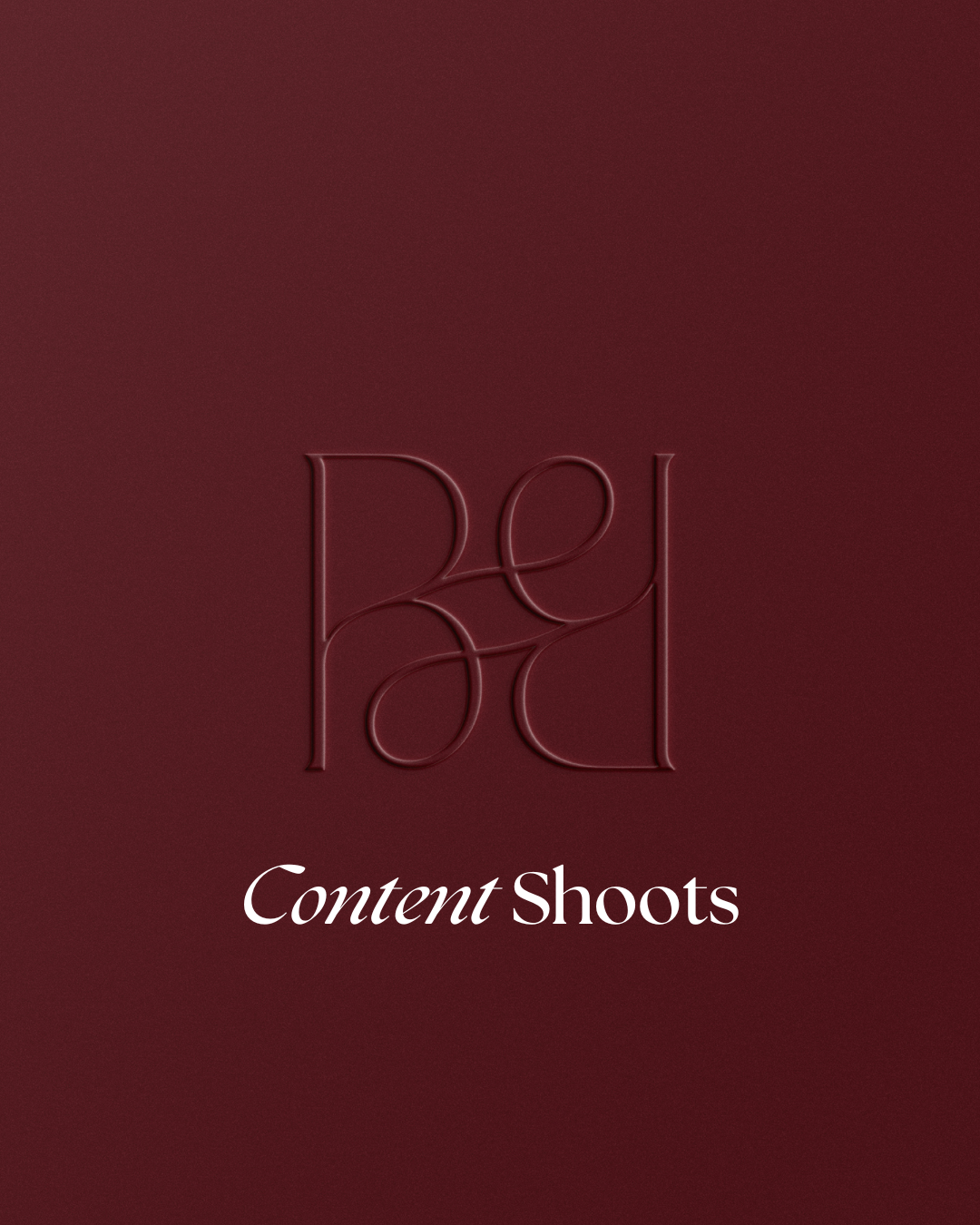 A deep red background with embossed minimalistic text that reads 'Rey ad' at the top and 'Content Shoots' below in white italics.