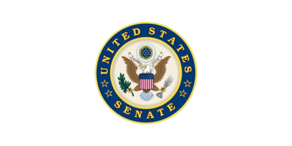 U.S. Senate seal with a yellow and white streak background.