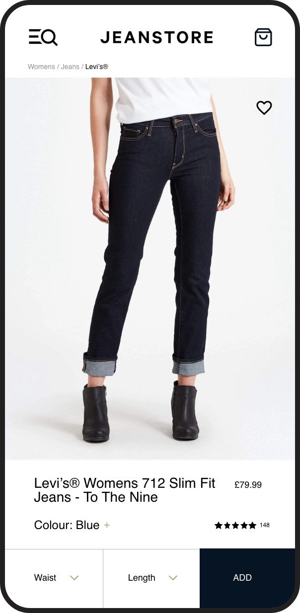 A woman wearing dark blue slim fit jeans and black ankle boots, with her hands by her sides, displayed on the JEANSTORE website.