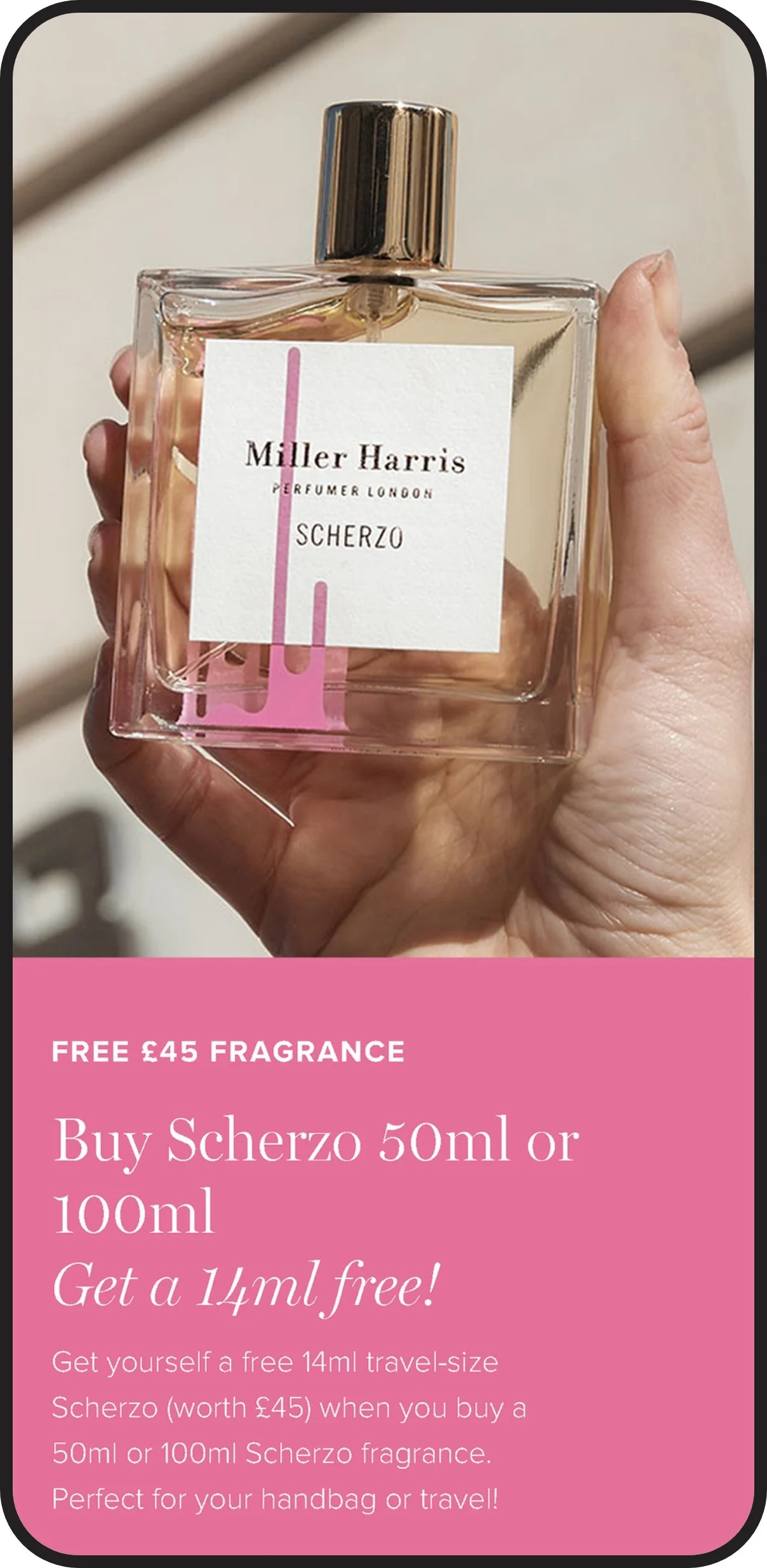 A hand holding a rectangular glass perfume bottle with a pink label and a shiny gold cap. There is promotional text on a pink background below the image advertising a free 14ml fragrance with purchase.