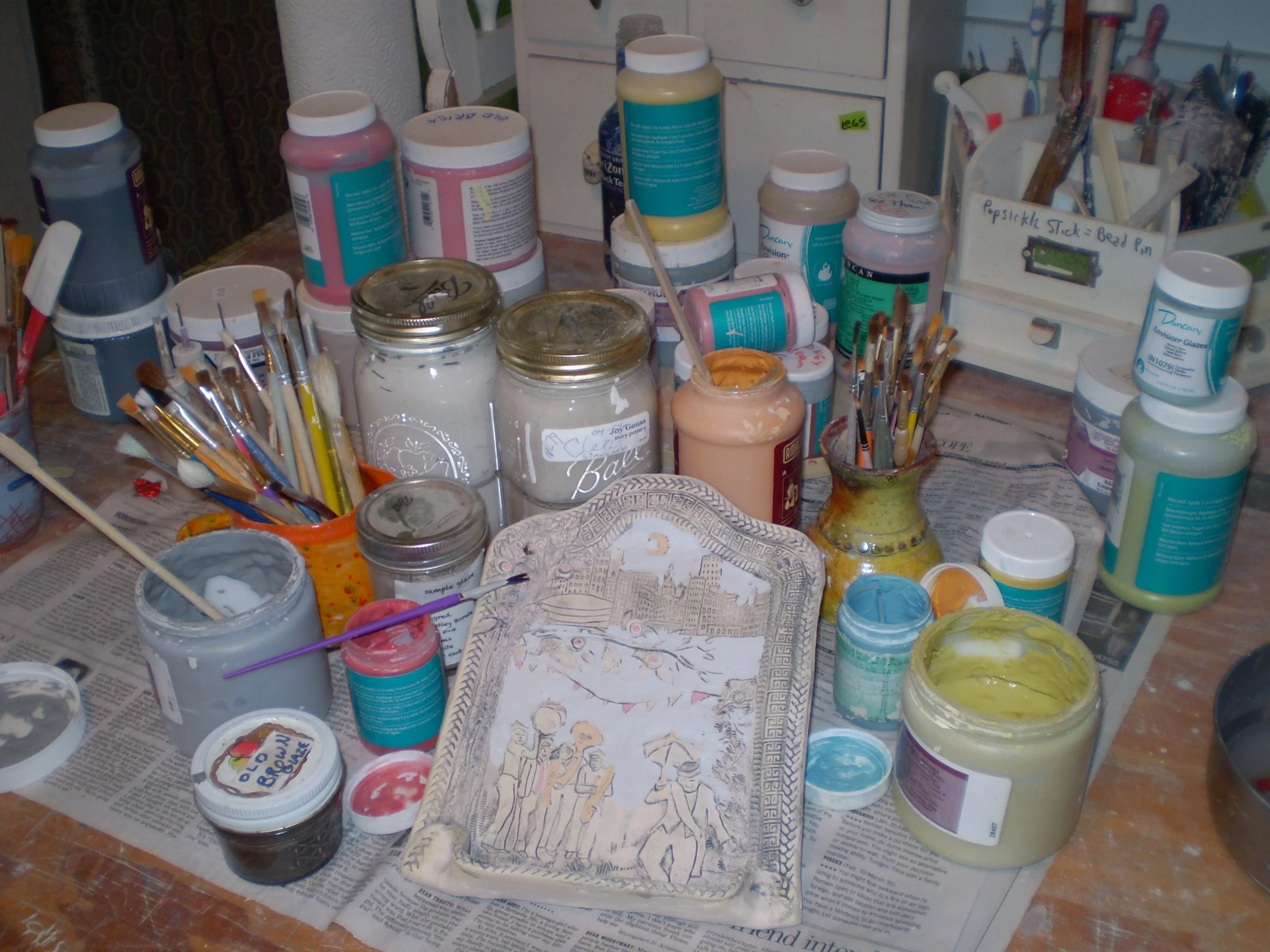 Artist's studio with glazes and other supplies
