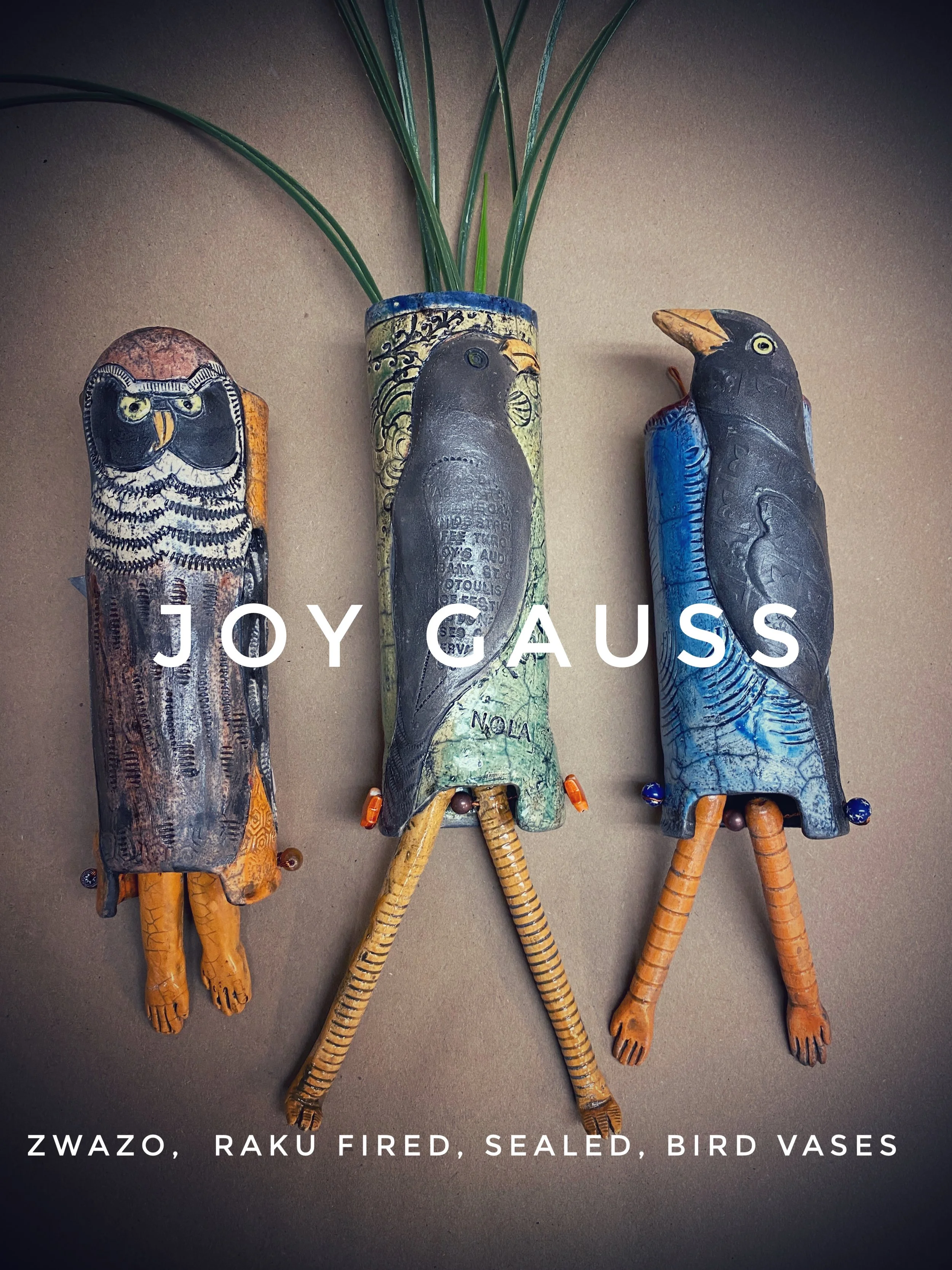 three raku fired image with dangling legs, colorfully glazed