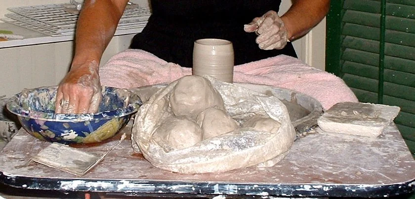 artist in studio creating pieces