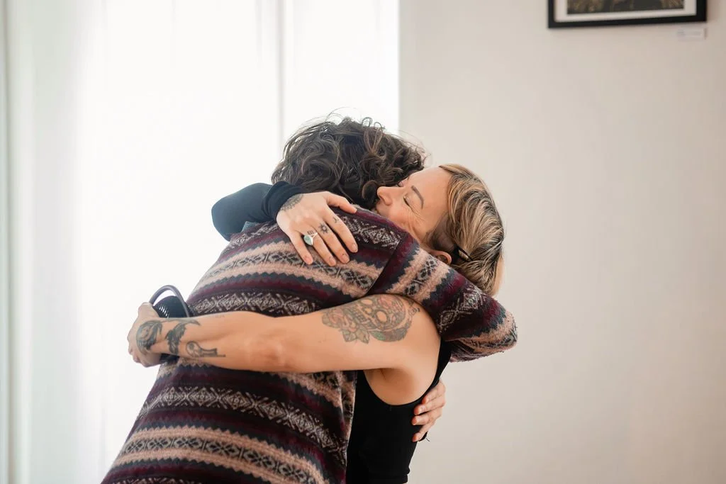 twowomenshareanembrace