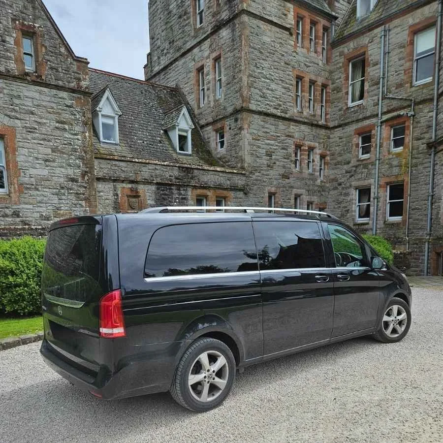 Black Mercedes V Class parked outside a historic Irish building during a private tour with Private Tours Ireland