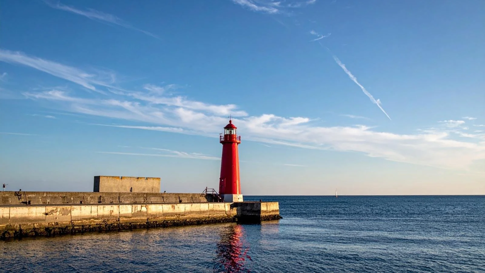 Poolbeg Lighthouse at the entrance to Dublin Bay, a striking coastal landmark often visited on private tours exploring the city’s maritime heritage and shoreline.