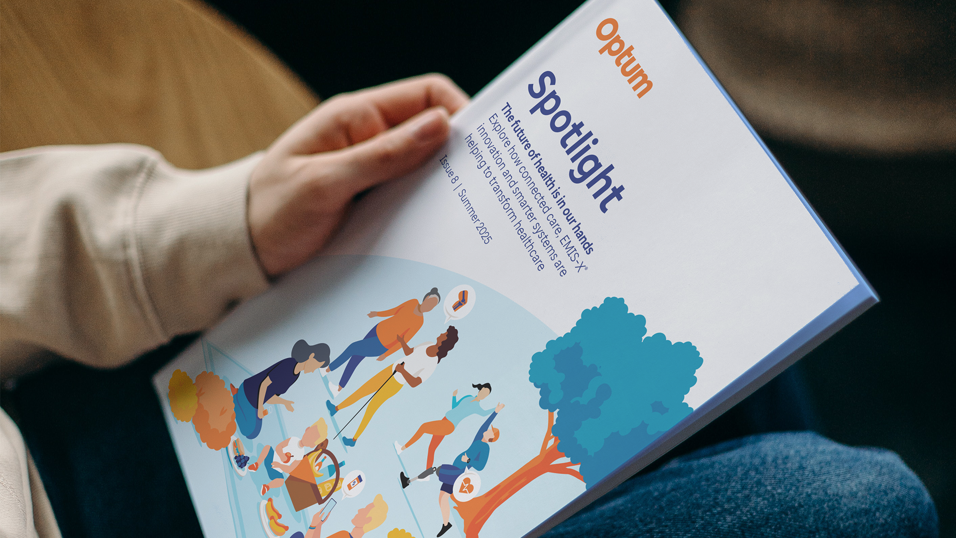 Spotlight Magazine in it's printed form being held in a pair of hands