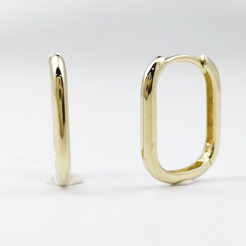 Two gold-colored metal rings, one upright and the other lying flat, on a white background.