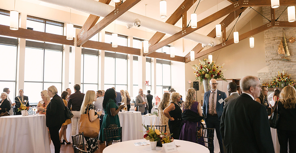 indoor event shot showing people talking