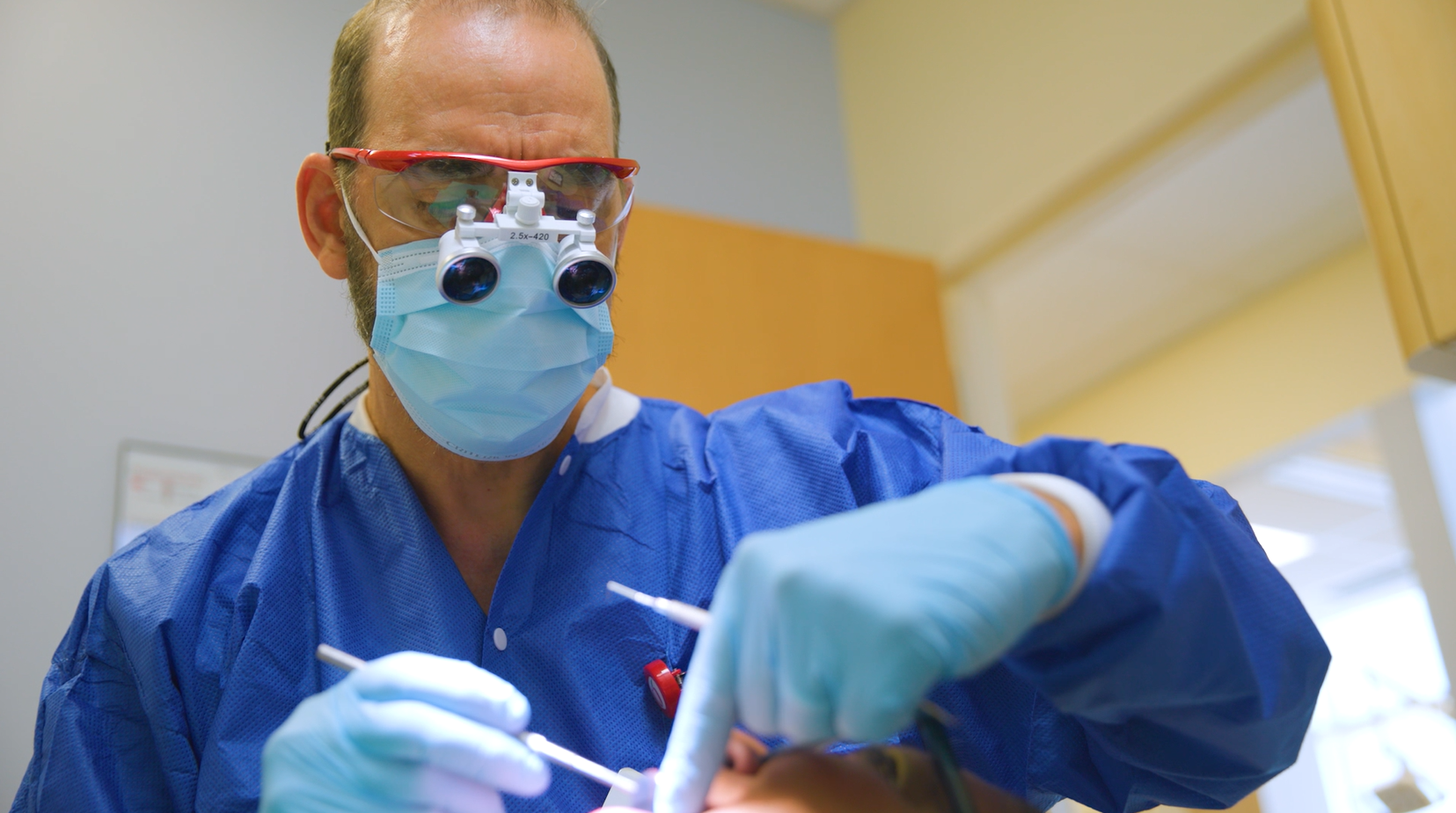 dental provider working with patient