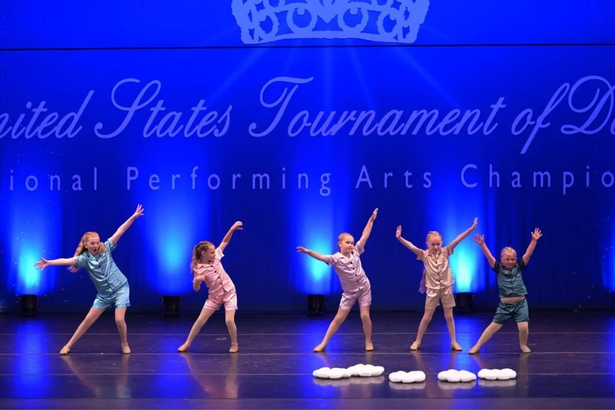 Comp Team Photo of Five Girls on Stage.JPG