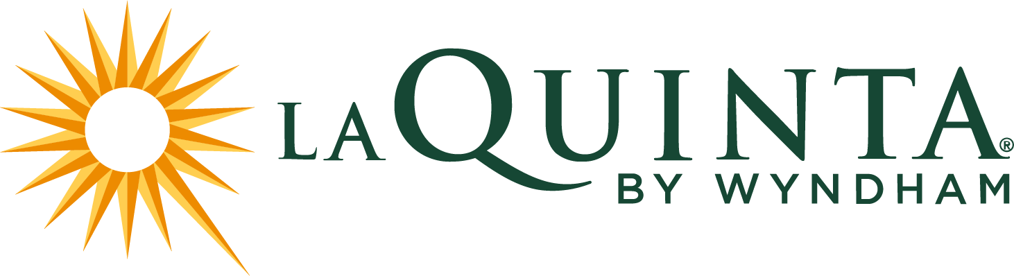 Logo for La Quinta by Wyndham featuring a yellow sunburst or star shape and green text.