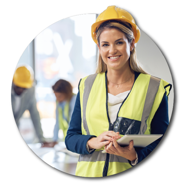 An organized scene indicating smooth projects, with a construction worker woman with a yellow safety helmet and vest holding a tablet, smiling at the camera, with other workers in the background.