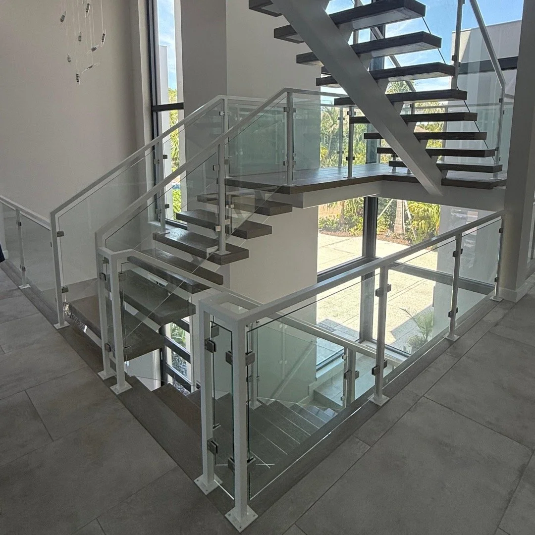 Interior post-and-clamp glass panel railing system