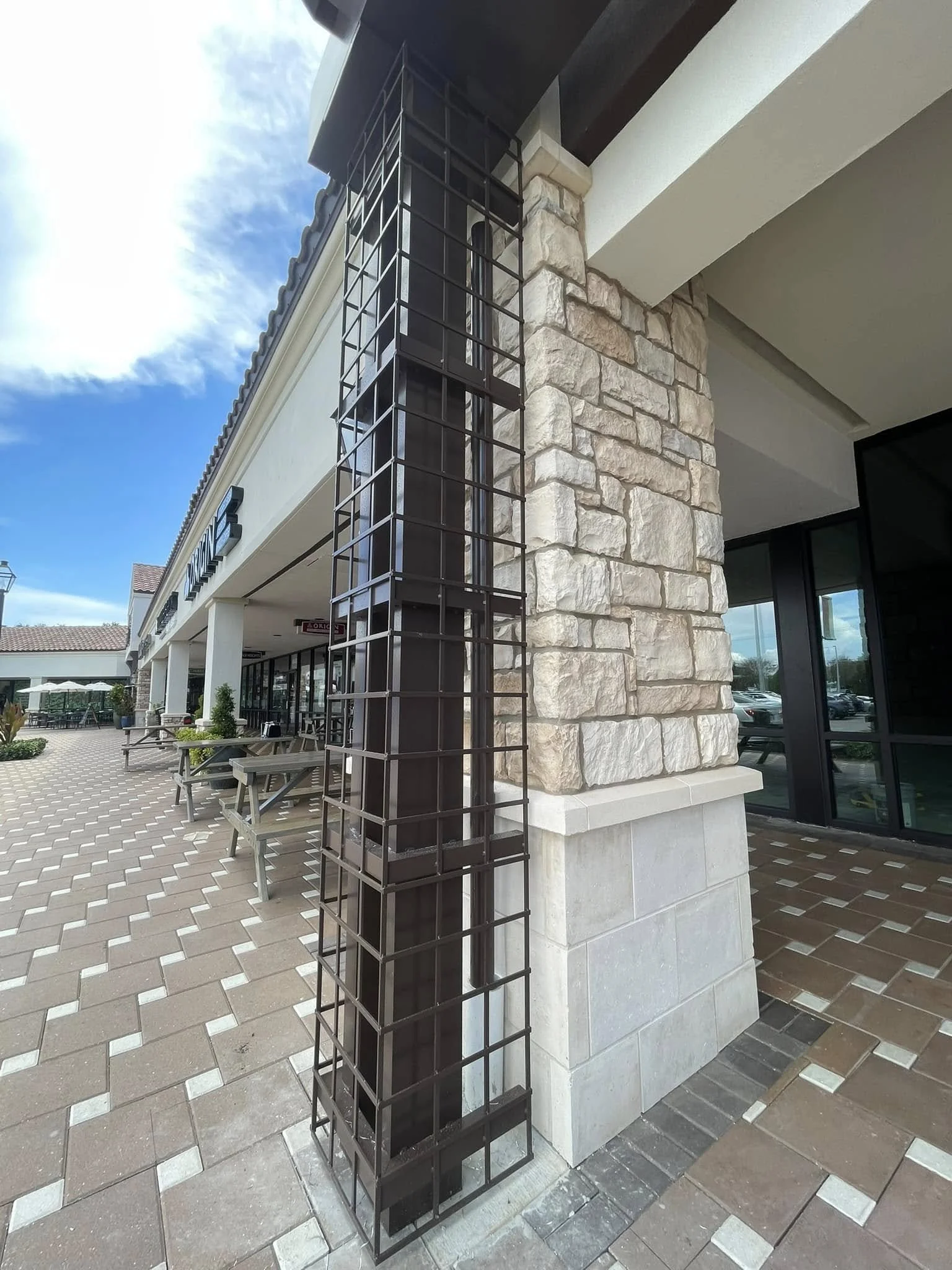Retail center black trellis pillars