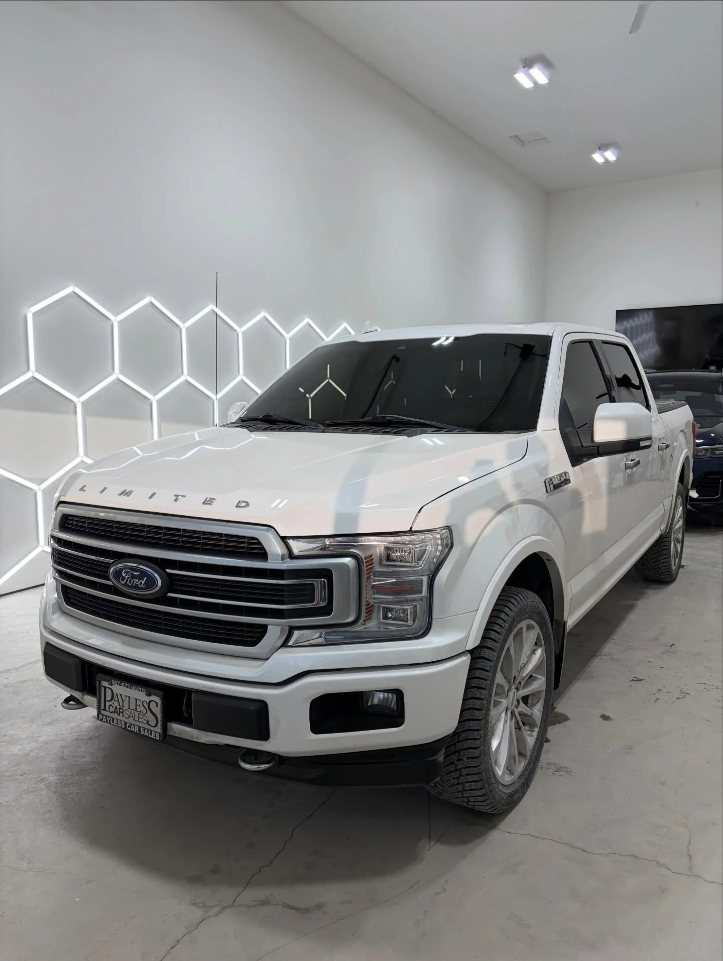 White F-150 finished right with full ceramic tint all the way around.