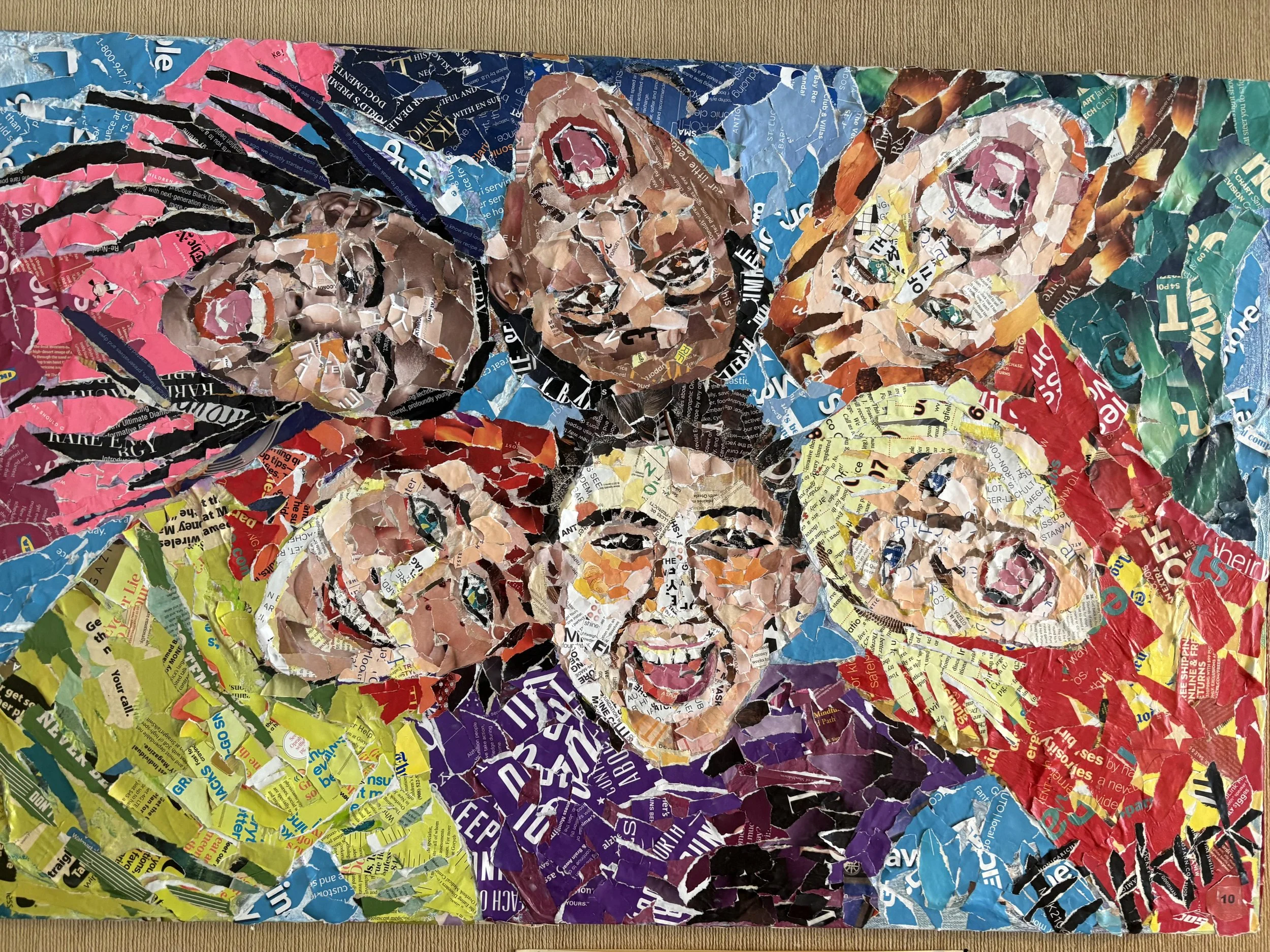 Collage of five smiling children made from torn colorful magazine and newspaper paper.
