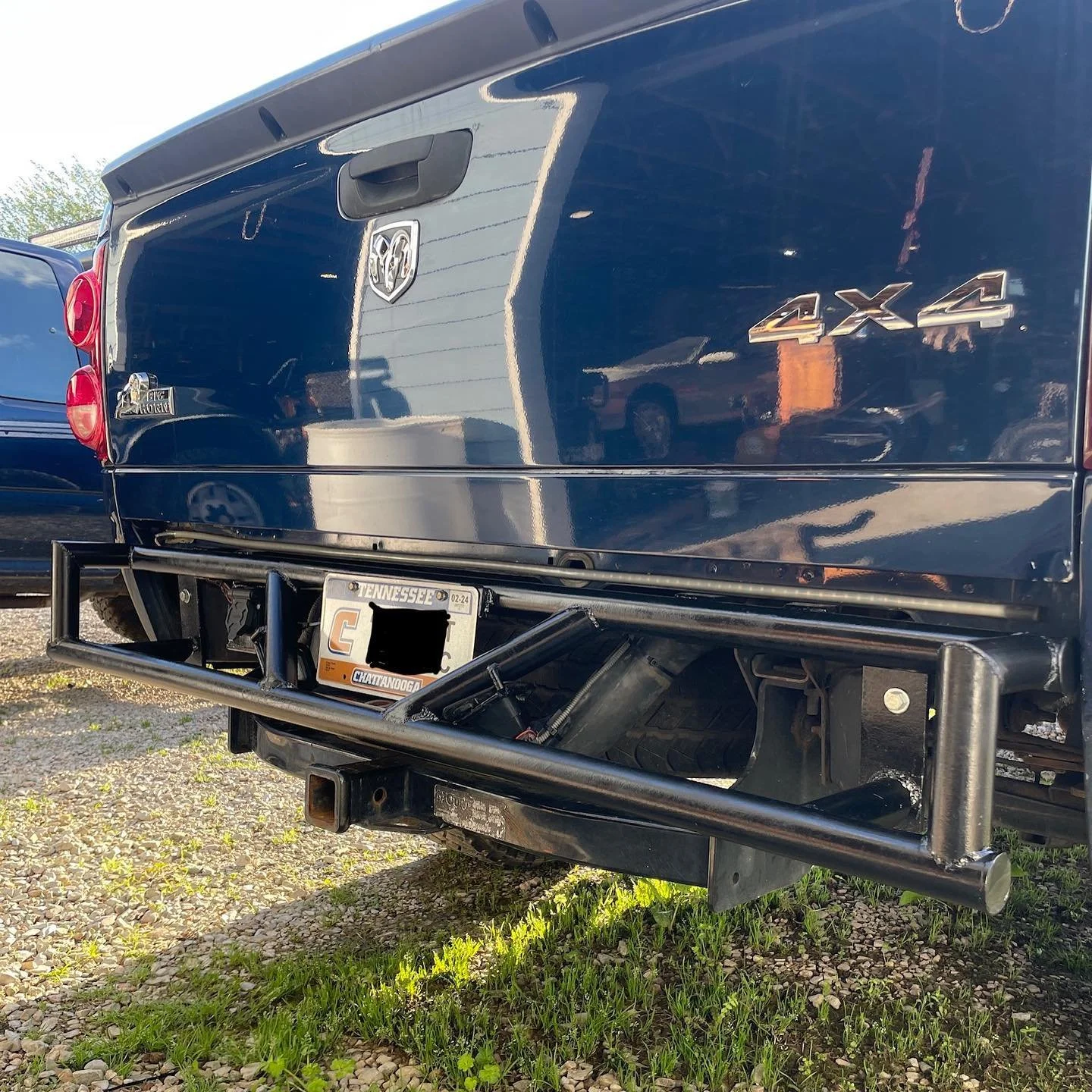 Another happy customer. Complete rear bumper with a simple but solid design. Featuring fitment for stock license plate lights on this sweet dodge ram.