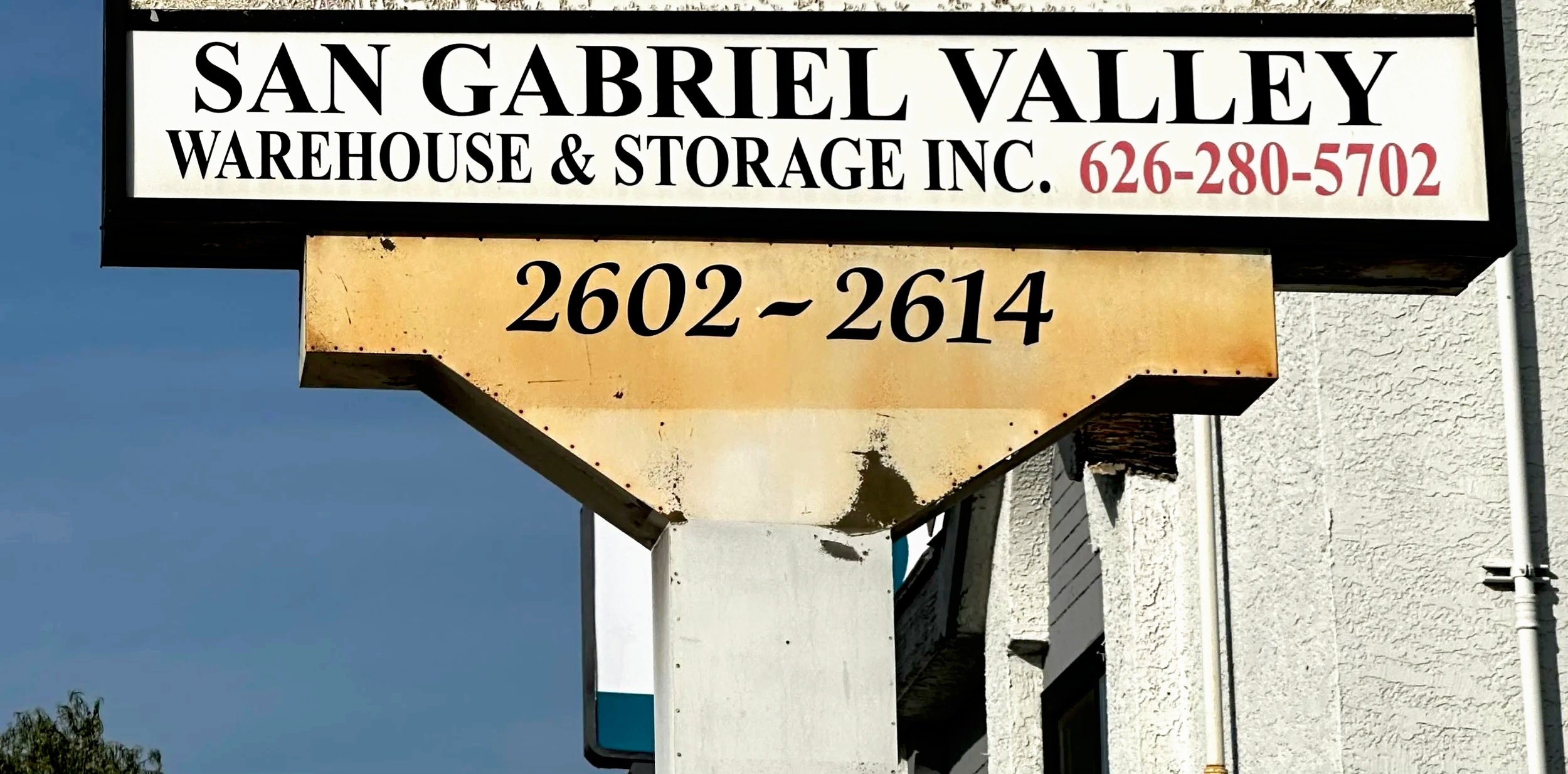 Sign for San Gabriel Valley Warehouse & Storage Inc., displaying the phone number 626-280-5702 and the address 2602-2614.