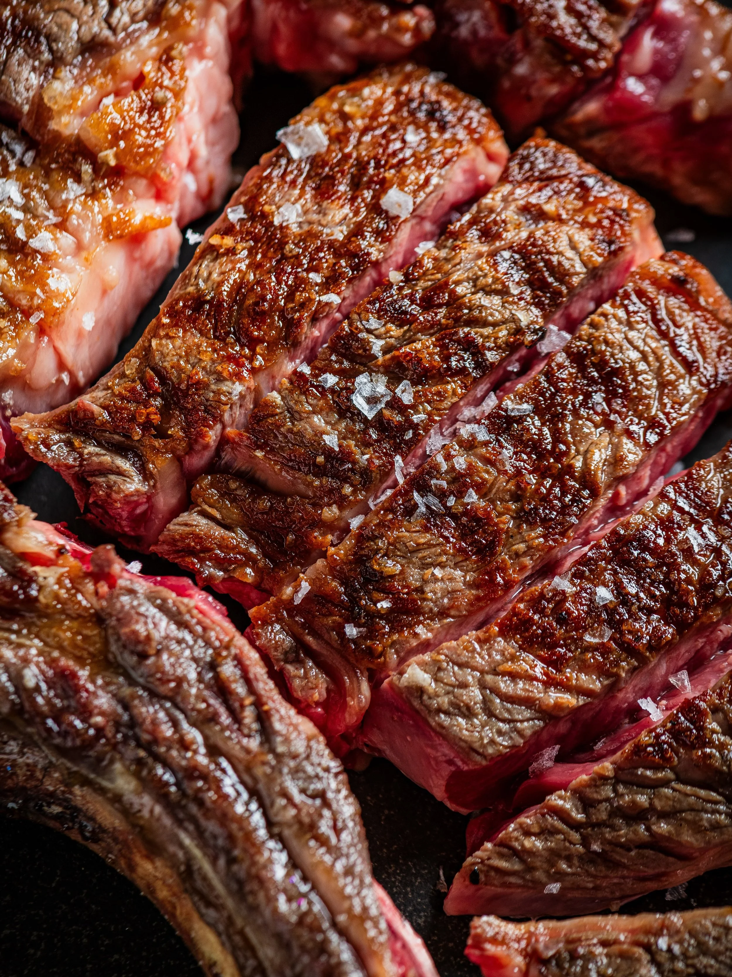 Our Chulet&oacute;n de Buey is cooked simply with a natural sea salt&mdash;harvested specially to be rich in umami.&nbsp;

It&rsquo;s then seared on the grill and caramelized to preserve the juices. 

Cooked to al punto (medium to medium-rare) or wha