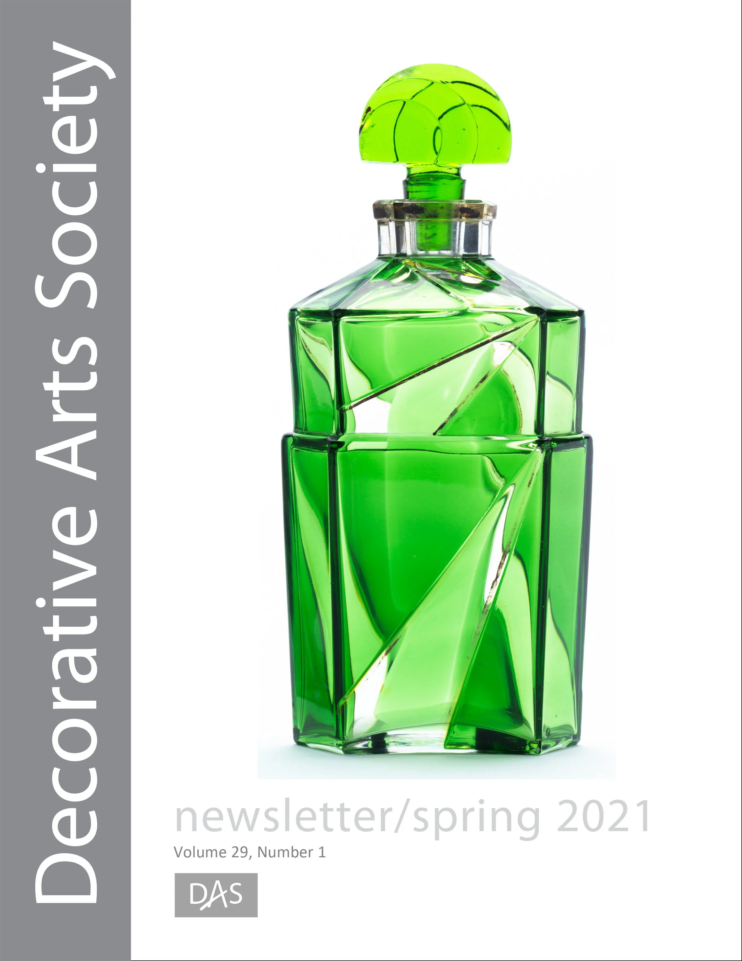 A magazine cover featuring a bright green bottle