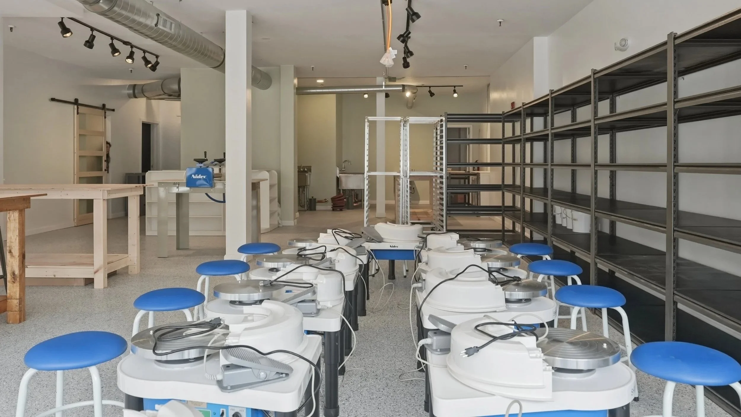 10 wheels for pottery classes and shelving