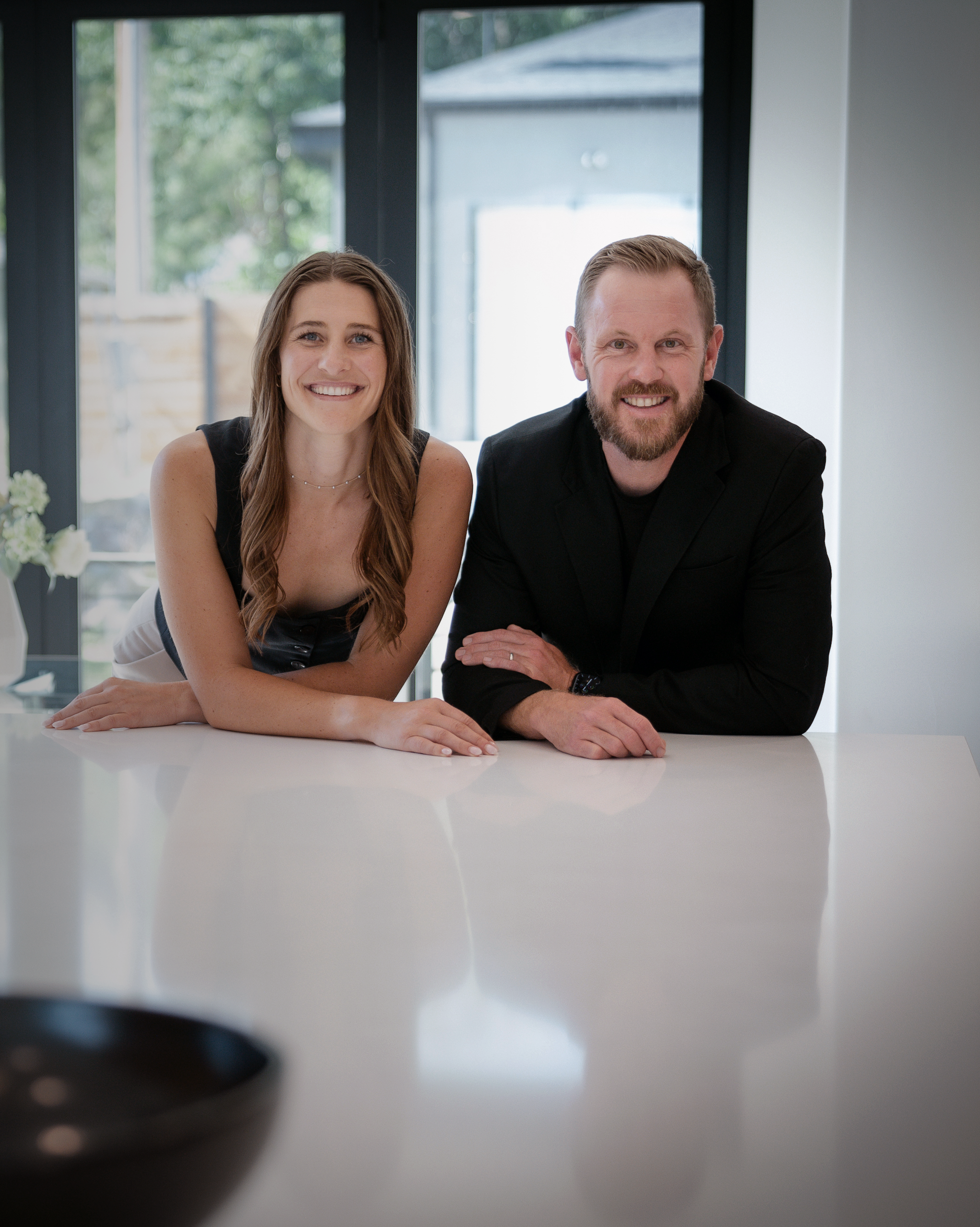 Denver real estate advisors meeting with clients about buying or selling a home