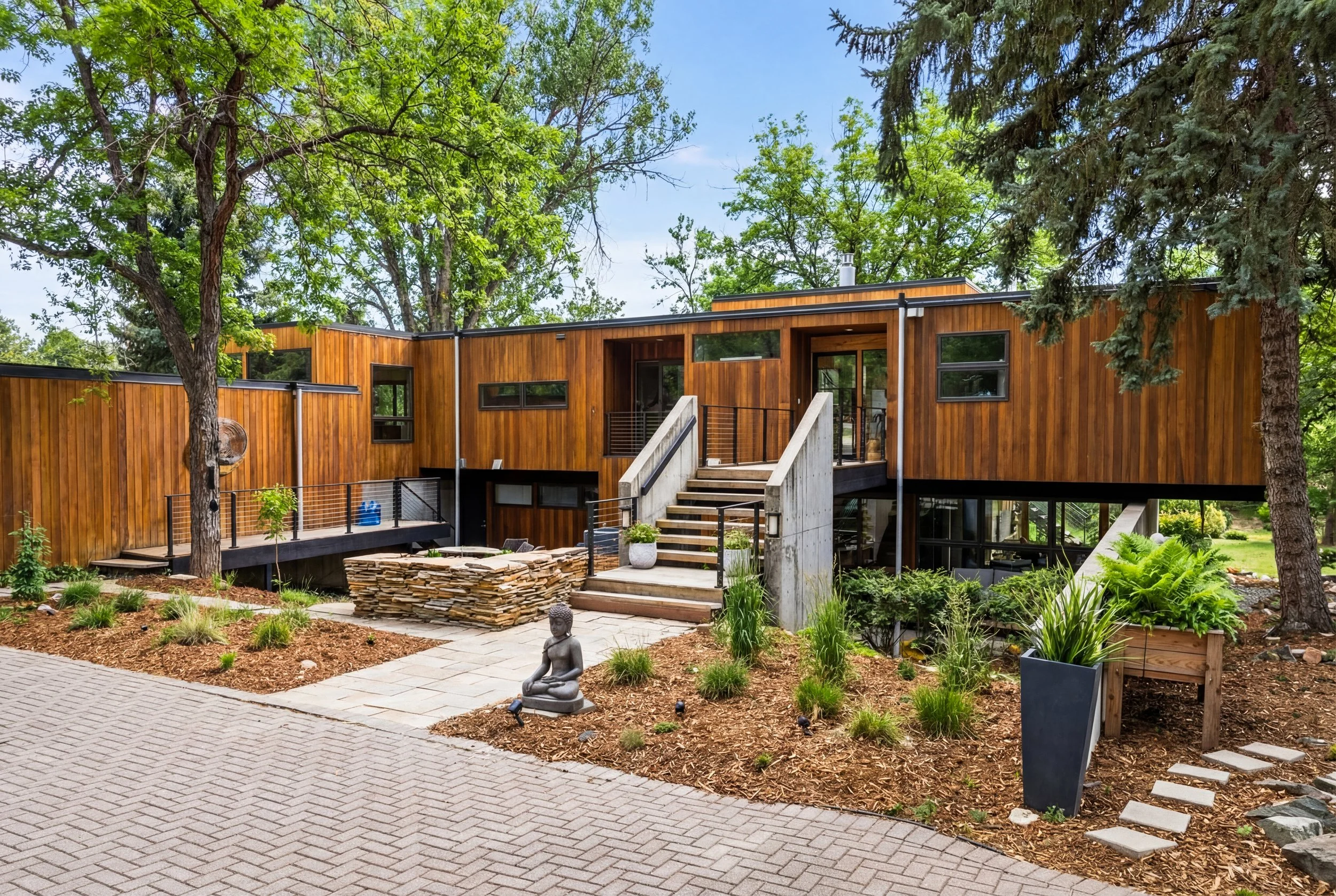 Modern Denver home exterior with landscaped entry, professionally marketed for sale.