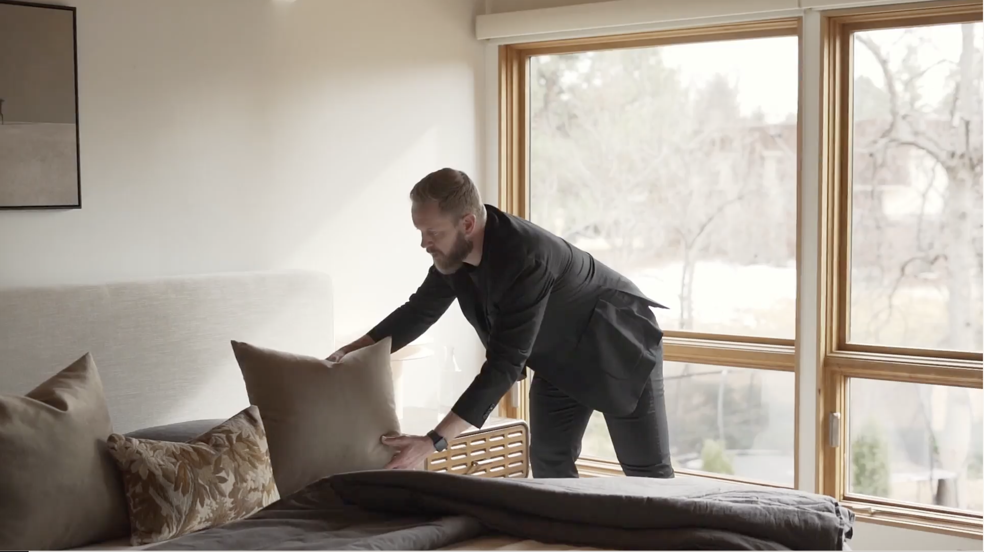 Denver real estate agent adjusting staging details before listing a home for sale.