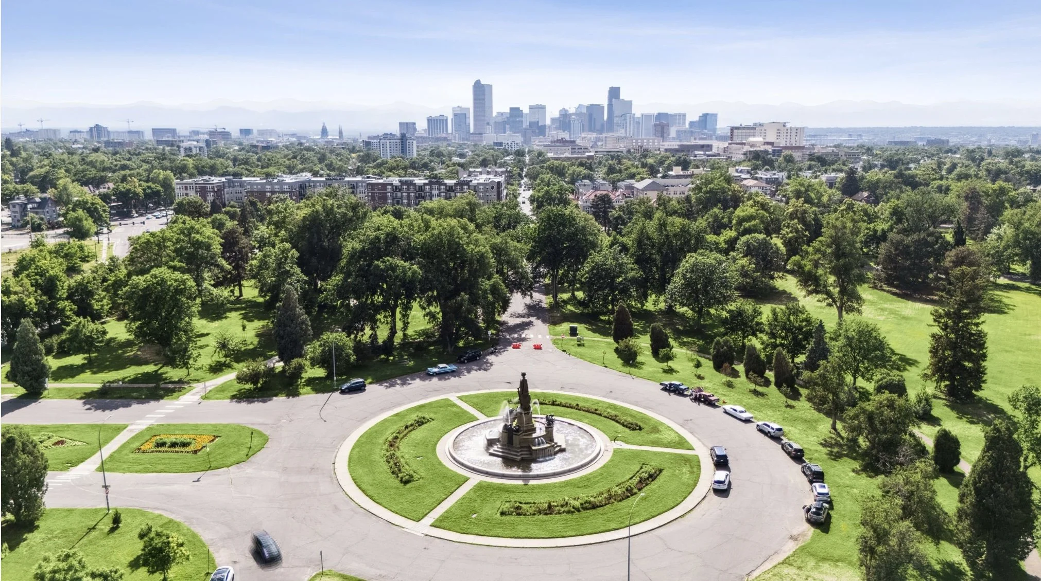 Aerial view of Denver skyline and City Park highlighting surrounding neighborhoods