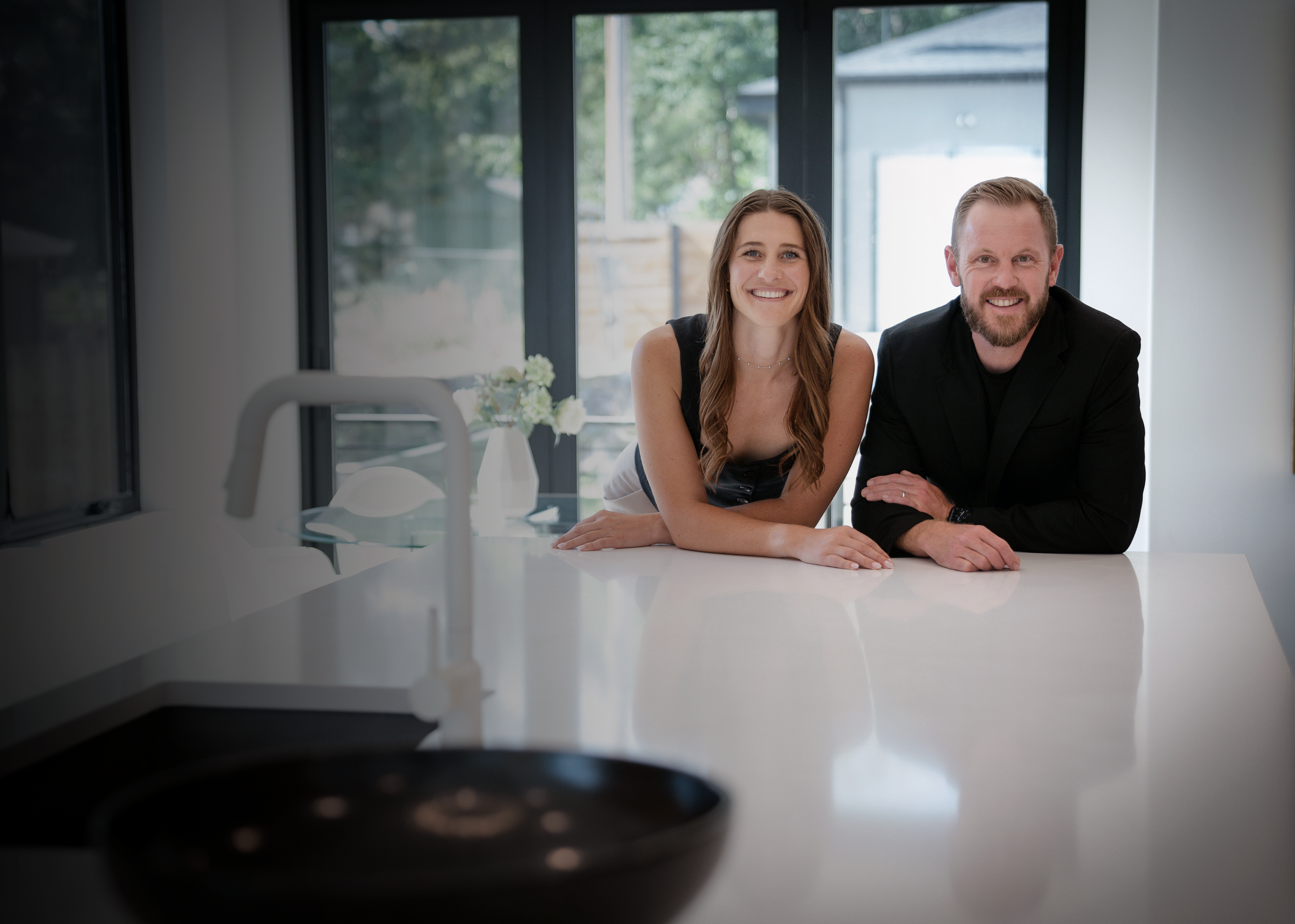 Denver real estate advisors meeting with clients about buying or selling a home